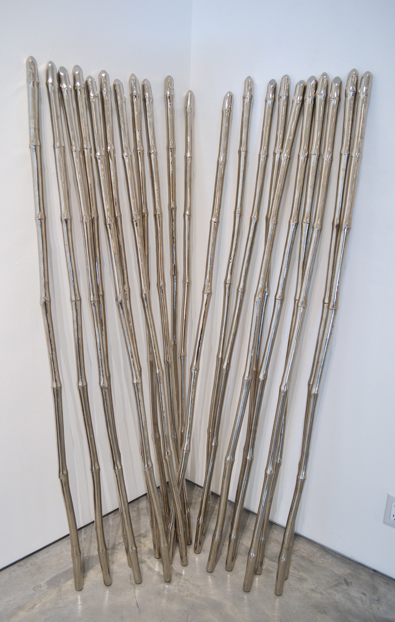 SUBODH GUPTA - Magic Wands 6 Magic Wands is a 2004-2005 creation by India’s most renowned contemporary artist, Subodh Gupta. The work seamlessly blends a sculptural approach with an installation art aesthetic to create a statement on his heritage and universal themes. Since Gupta’s first installation in 1996, “Twenty-nine Mornings,” the artist has been driven to incorporate daily, utilitarian objects into his work. Bicycles, wands, pans all play heavily in the work of Gupta.
<br>
<br>Gupta’s work often reflects the economic transformations in India- and provides a view into the lives of those whose lives are changed by the rise of the country as a global economic power. Gupta is widely collected as the pre-eminent Indian Contemporary artist. His work is included in the permanent collections of the MFA Houston and Victoria and Albert Museum, London, among many others.