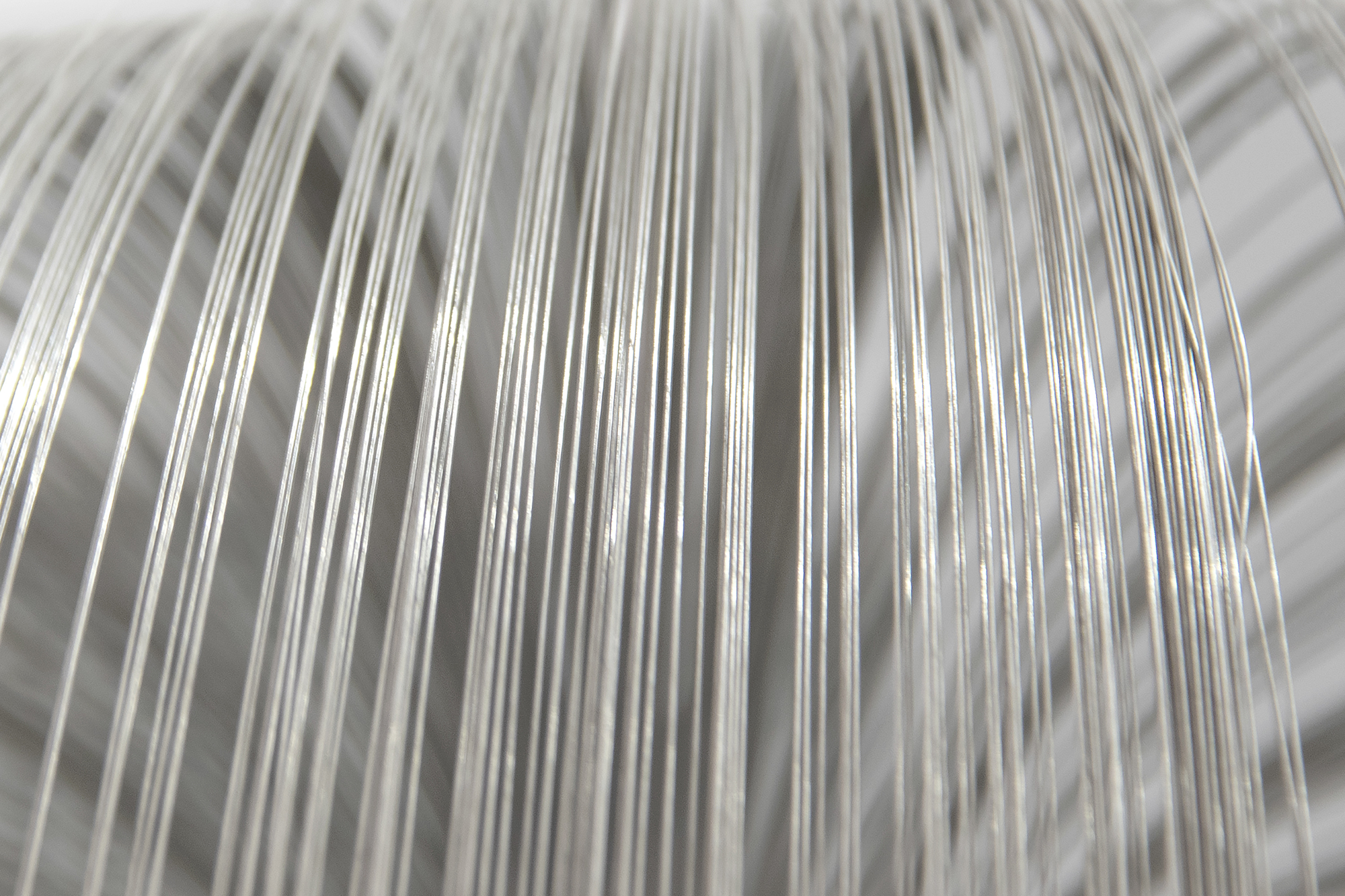 HARRY BERTOIA - Untitled (Suspended Willow) Harry Bertoia’s Willow sculpture resonates as an expression of grace and delicacy; qualities that bely the usual associations we have with the intrinsic properties of the alloy of which it is made. This suspended version – the rare version of Willow - seems to have a self-aware presence; one that delights in that contrast of properties. Yet it invites nothing more than existential pleasure in the viewing of it. Think of Willow as a boldly articulated version of Calder if the latter master had a more organic or corporeal evocation in mind. Suspended, it commands its area yet respects its spatial relationship to its surround. Light, form, space – these are conceptual tools of the sculptor. But who else would think to use reflective material more readily associated with inflexibility and tensor strength to create a bouquet of cascading strands of stainless steel, suspended in space, flora-like and so gracefully beautiful?