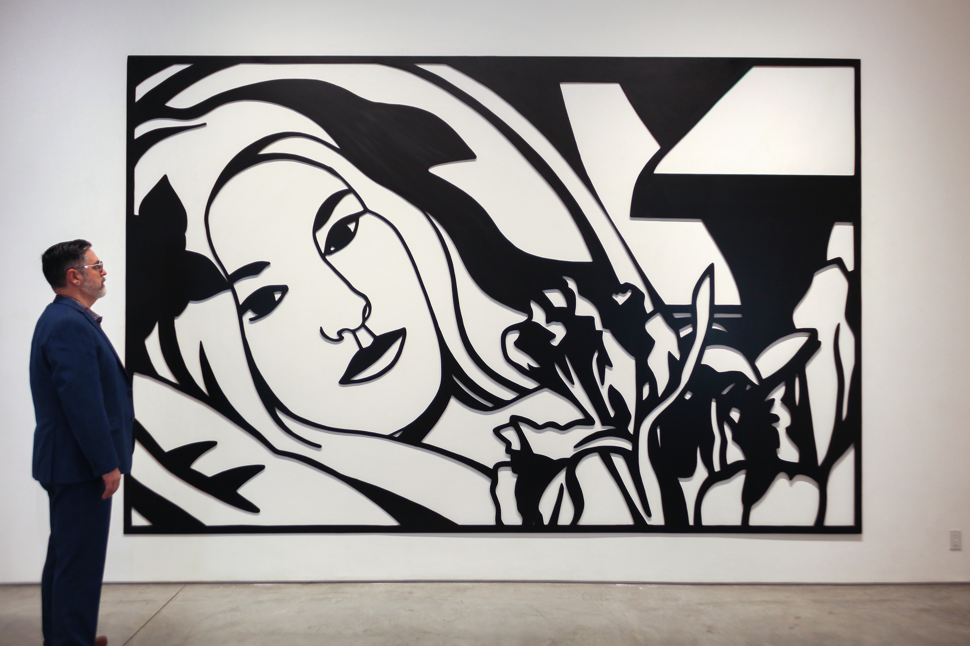 Tom Wesselmann will undoubtedly be remembered for associating his erotic themes with the colors of the American flag. But Wesselmann had considerable gifts as a draftsman, and the line was his principal preoccupation, first as a cartoonist and later as an ardent admirer of Matisse. That he also pioneered a method of turning drawings into laser-cut steel wall reliefs proved a revelation. He began to focus ever more on drawing for the sake of drawing, enchanted that the new medium could be lifted and held: “It really is like being able to pick up a delicate line drawing from the paper.”<br><br>The Steel Drawings caused both excitement and confusion in the art world. After acquiring one of the ground-breaking works in 1985, the Whitney Museum of American Art wrote Wesselmann wondering if it should be cataloged as a drawing or a sculpture. The work had caused such a stir that when Eric Fischl visited Wesselmann at his studio and saw steel-cut works for the first time, he remembered feeling jealous. He wanted to try it but dared not. It was clear: ‘Tom owned the technique completely.’<br><br>Wesselmann owed much of that technique to his year-long collaboration with metalwork fabricator Alfred Lippincott. Together, in 1984 they honed a method for cutting the steel with a laser that provided the precision he needed to show the spontaneity of his sketches. Wesselmann called it ‘the best year of my life’, elated at the results that he never fully achieved with aluminum that required each shape be hand-cut.  “I anticipated how exciting it would be for me to get a drawing back in steel. I could hold it in my hands. I could pick it up by the lines…it was so exciting…a kind of near ecstasy, anyway, but there’s really been something about the new work that grabbed me.”<br><br>Bedroom Brunette with Irises is a Steel Drawing masterwork that despite its uber-generous scale, utilizes tight cropping to provide an unimposing intimacy while maintaining a free and spontaneous quality. The figure’s outstretched arms and limbs and body intertwine with the petals and the interior elements providing a flowing investigative foray of black lines and white ‘drop out’ shapes provided by the wall. It recalls Matisse and any number of his reclining odalisque paintings. Wesselmann often tested monochromatic values to discover the extent to which color would transform his hybrid objects into newly developed Steel Drawing works and, in this case, continued with a color steel-cut version of the composition Bedroom Blonde with Irises (1987) and later still, in 1993 with a large-scale drawing in charcoal and pastel on paper.