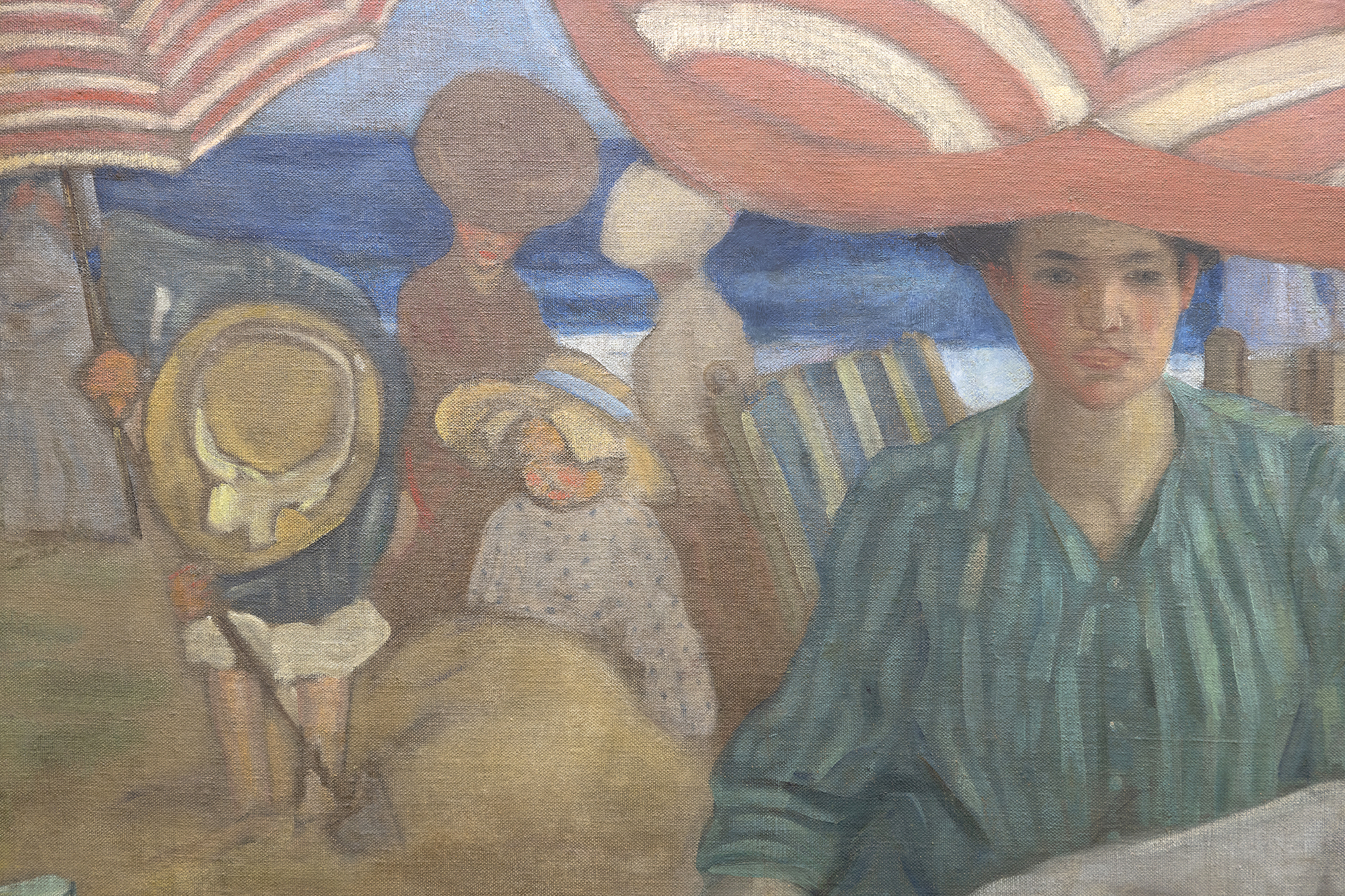 Frederick Frieseke is often regarded as the finest American Impressionist painter of the figure. Yet when he came to study at Académie Juilian in 1898, several les Nabis painters remained a lingering presence, and it was the rich, decorative patterns of Edouard Vuillard and Pierre Bonnard that served as the blueprint for his early success. That influence is clearly demonstrated in the unrestrained repetition of the voluminous, pleated, striped umbrellas of Afternoon at the Beach, a canvas mural installed in the opulent Hotel Shelburne dining room overlooking the Atlantic City Boardwalk. The unifying impact of that repetitive element imbues the setting with cloud-like loft within a color scheme, evoking Vuillard and the richness of a Gobelin tapestry, rather than the effect of sunlight and broken color that mark his more familiar paintings from the decade of 1910 to 1920.<br><br>Afternoon at the Beach was installed under the artist’s direction in February 1906. It remained on view for decades at the swanky hotel that enticed “Diamond Jim” James Buchanan Brady to pay one thousand dollars a week for permanent residence and was an unfading memory for throngs of well-heeled socialites, financiers, and notables from Irving Berlin to John Philip Sousa and Ethel Barrymore to Al Jolson. Undoubtedly, its presence high on the grand dining room wall contributed to the artist’s popularity and renown.<br><br>Today, we may look upon this long, frieze-like composition as a delightful fin-de-siécle costume study or an informative expose of Victorian mores as suggested by the separate spheres of gender groupings. But mostly, Afternoon at the Beachrecounts the artist’s unbridled delight and appreciation of women, here, expressed within familial, maternal, and social contexts. It is the subject and theme that brought Frieseke acclaim and awards on both sides of the Atlantic and which, to this day, endears him to the many who count him among the most beloved of American figurative painters.
