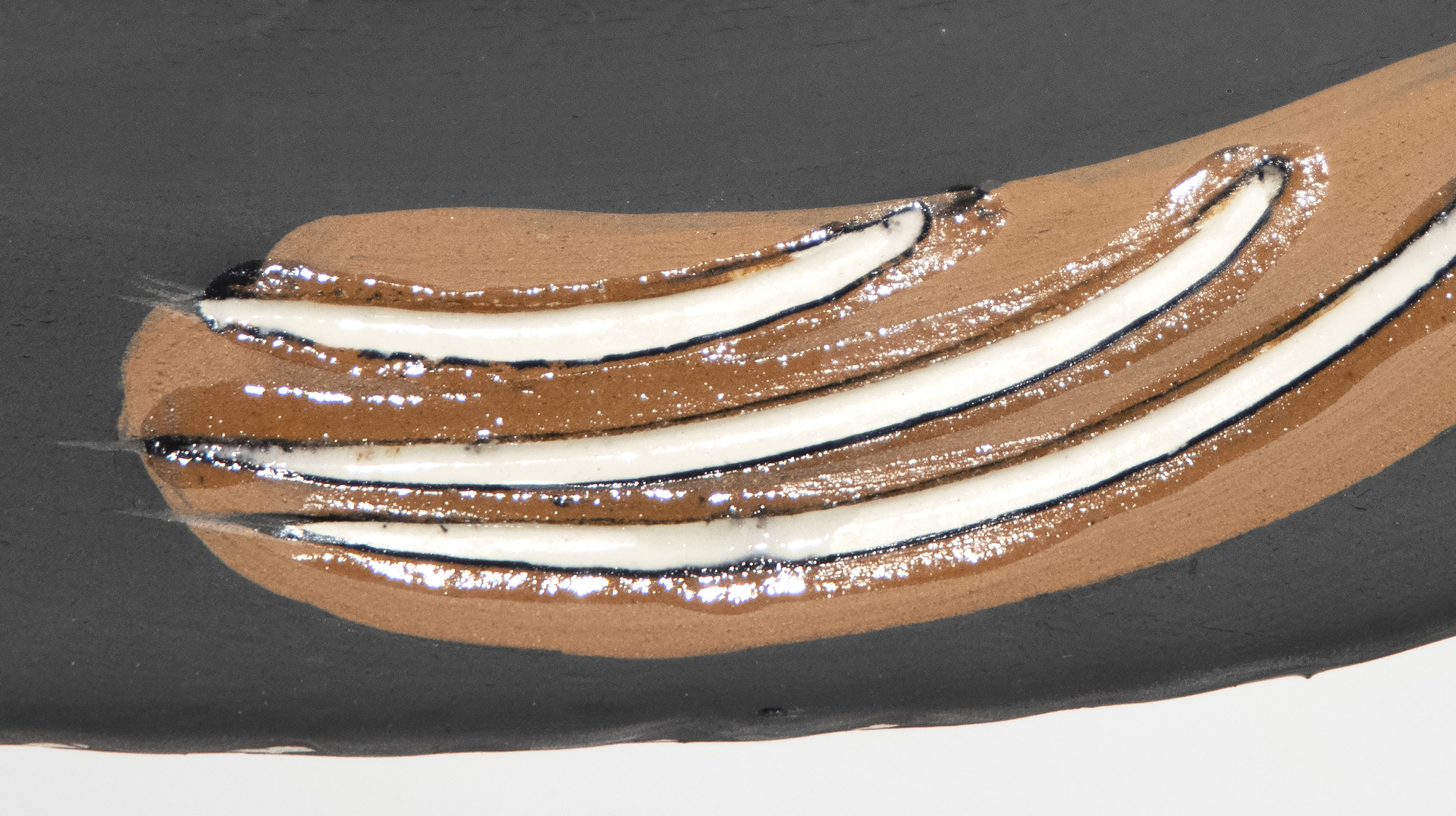 PABLO PICASSO - La Danse - assiette en céramique blanche, partiellement gravée, avec engobe et glaçure colorés - 12 1/2 x 15 in.