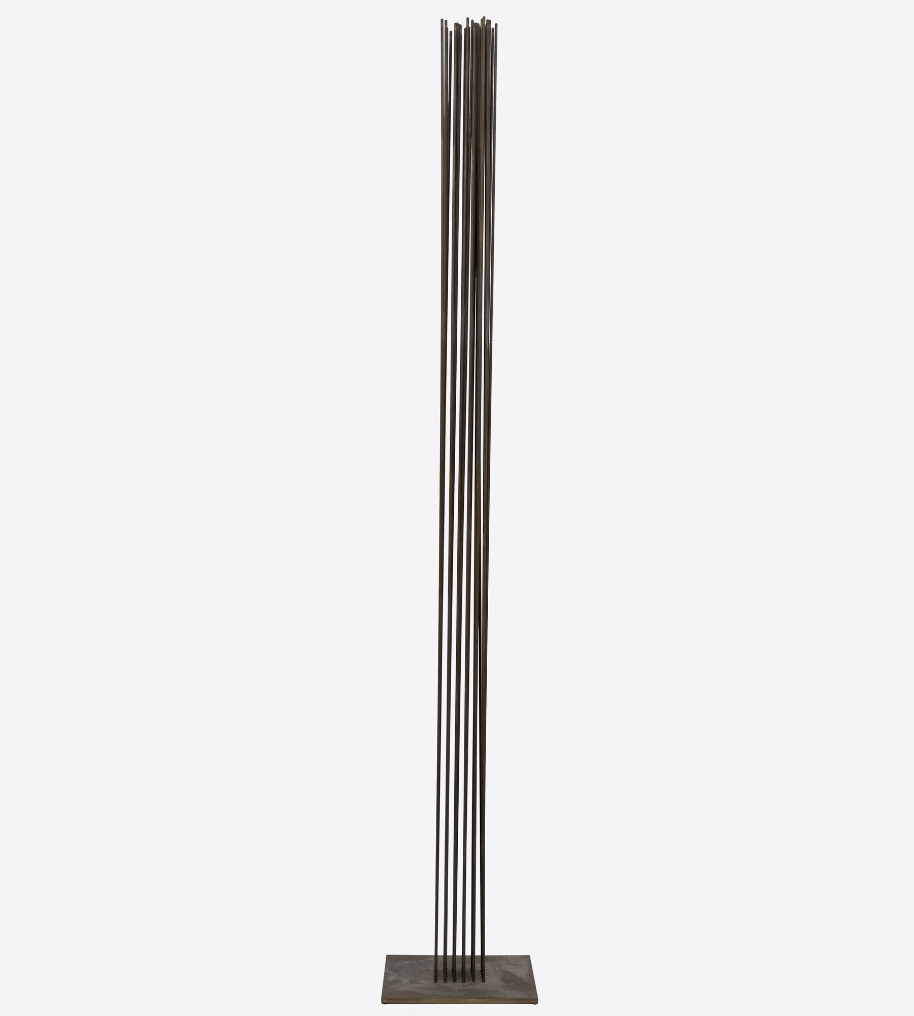 HARRY BERTOIA - Untitled (Sounding Sculpture) <div><font face=Calibri size=3 color=black>Standing at an impressive 103 inches, this elegantly spare “Sonambient” sculpture by Harry Bertoia allows us to marvel at one of the finest artisans of his generation. This piece, the tallest in the series currently available here at Heather James Fine Art, features a precise arrangement of 36 slender tines in a 6 x 6 grid. This arrangement's uniformity and symmetry are visually captivating and crucial for the sculpture's acoustic properties. The rods, austere and uncapped by finials, have an aged patina with copper undertones, suggesting Bertoia's use of copper or a similar alloy known for its resonant qualities and distinctive coloration. Given the outstanding length of these rods, the attachment method is particularly noteworthy. Bertoia meticulously inserted each rod into individual holes in the base plate using precision drilling and securing techniques such as welding that ensured the rods were firmly anchored and stable, maintaining the structural integrity essential for consistent acoustic performance.</font></div>
<br>
<br><div> </div>
<br>
<br><div><font face=Calibri size=3 color=black>Beyond his uncompromising nature, Bertoia's work draws significant inspiration from natural elements. This sculpture's tall, slender rods evoke images of reeds or tall grasses swaying gently in the wind. This dynamic interaction between the sculpture and its environment mirrors the movement of plants, creating an immersive, naturalistic experience. Yet when activated or moved by air currents, the rods of this monumental work initiate metallic undertones that confirm its materiality without betraying its profound connection to the natural world.</font></div>
<br>
<br><div><font face=Calibri size=3 color=black>Integrating technical precision and natural inspiration depends on exacting construction that ensures durability and acoustic consistency, while its kinetic and auditory nature imbues the piece with a sense of vitality. This fusion invites viewers to engage with the sculpture on multiple sensory levels, appreciating its robust craftsmanship and evocative, naturalistic qualities. Bertoia's ability to blend these elements results in a work that is both a technical marvel and a tribute to the beauty of the natural world.</font></div>