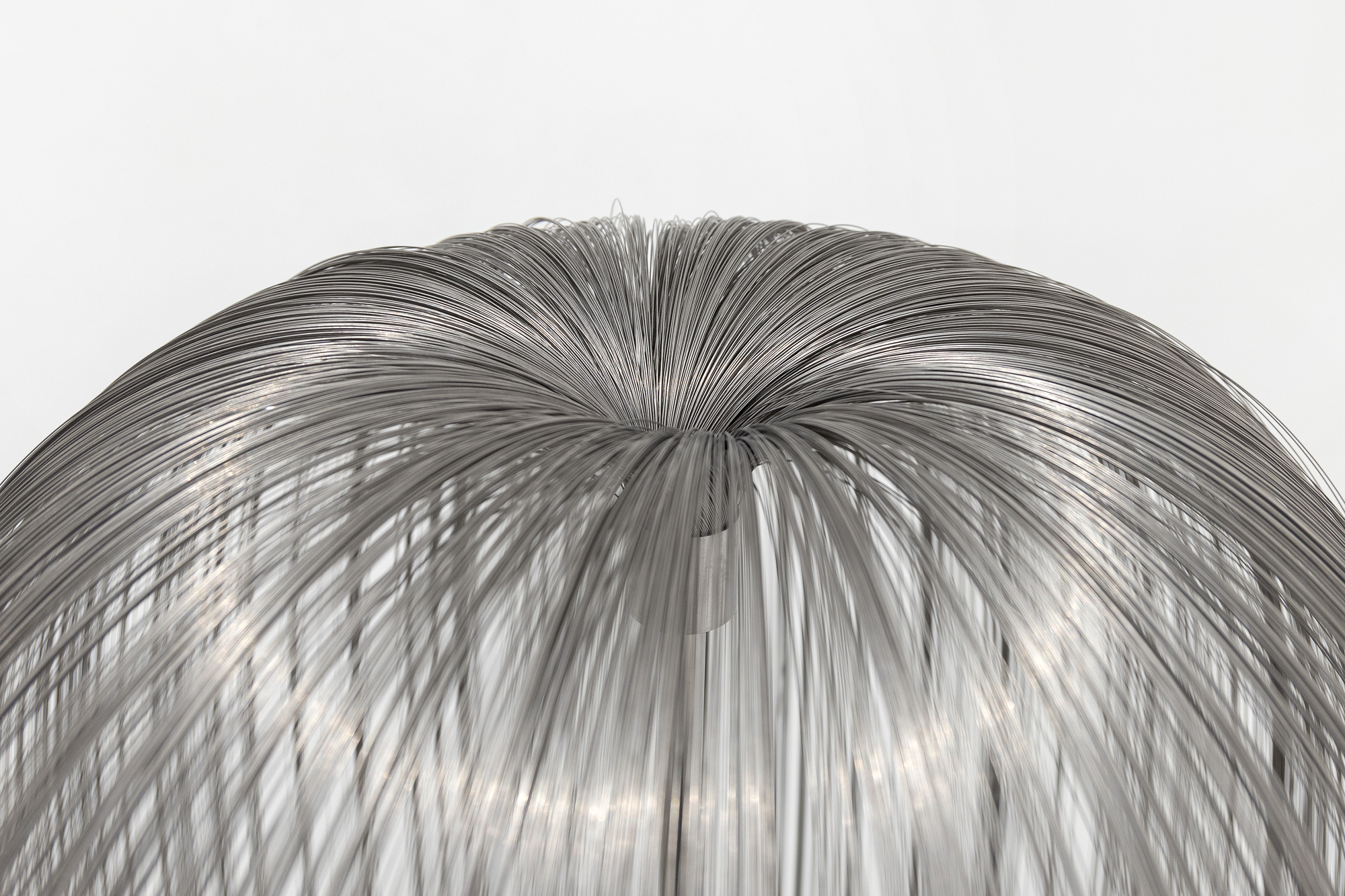 HARRY BERTOIA - Untitled (Willow) <div><font face=Lato size=3 color=black>In Harry Bertoia's oeuvre, "<em>Willow</em>" stands apart as an extraordinary synthesis of natural inspiration and innovative metalwork. Its cascading strands of stainless-steel capture the weeping elegance of a willow tree's drooping branches while introducing a dynamic, interactive quality through its shimmering surface and subtle responsiveness to movement. The strands—whether referred to as "tinsels," "filaments," or "tendrils"—reflect the delicacy of natural forms, blending artistry with technical mastery.</font></div>
<br>
<br><div><font face=Lato size=3> </font></div>
<br>
<br><div><font face=Lato size=3 color=black>Bertoia, a visionary sculptor with an unparalleled ability to transform industrial materials into organic beauty, likely employed meticulous processes to create "<em>Willow,</em>" cutting thin sheets of stainless steel into fine strips and expertly attaching them to a central core, positioning each strand to flow like water or sway like leaves in the breeze. The tactile quality of the strands, which respond to air currents or touch, invites the viewer into a contemplative engagement with the work, much like one might feel beneath the canopy of a willow tree.</font></div>
<br>
<br><div><font face=Lato size=3> </font></div>
<br>
<br><div><font face=Lato size=3 color=black>This piece epitomizes Bertoia's lifelong fascination with nature, stemming from his early years in the rural village of San Lorenzo, Italy. His sensitivity to the organic world continually informed his artistic practice, from his celebrated Sonambient sound sculptures to creations like “<em>Willow</em>, “which reimagine the relationship between form and environment. As he once said, "I no longer hold onto terms like music and sculpture. Those old distinctions have lost all their meaning."</font></div>
<br>
<br><div><font face=Lato size=3> </font></div>
<br>
<br><div><font face=Lato size=3 color=black>Once again , Bertoia captivates us by reaching beyond the traditional boundaries of sculpture, delivering a work that is as much a sensory experience as a visual one. It is a harmonious blend of natural inspiration and innovative artistry, a reminder of the sacred beauty found in the intersection of art and the natural world.</font></div>