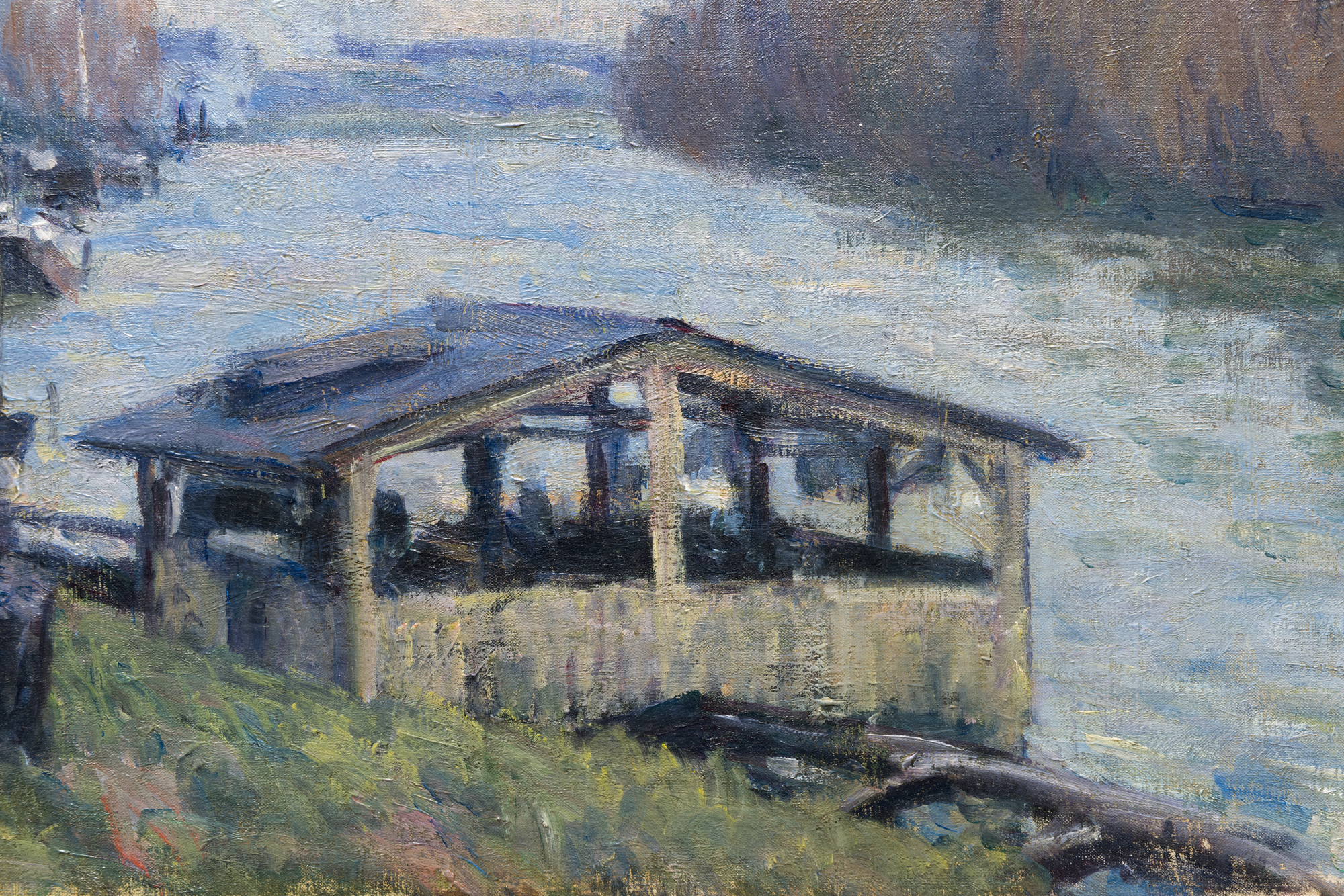 <div>Alfred Sisley’s <em>Le Lavoir de Billancourt</em> (1879) is a superb example of the artist’s lifelong devotion to painting directly before nature, and to the quiet drama of landscape in flux. Often described as the “purest” plein air painter of the Impressionist circle, Sisley maintained an almost exclusive relationship with landscape, attending to the subtlest changes of season, weather, and time of day. His river scenes in particular have long been compared to Monet’s for their sensitivity to water—its shifting reflections, softened edges, and the way light dissolves form into atmosphere. </div><br><br><div>&nbsp;</div><br><br><div>Painted along the Seine at Billancourt—an industrial town west of Paris—this work belongs to the sequence of views Sisley produced after the upheavals of 1871, when he moved his family first to Louveciennes and later to nearby Marly-le-Roi. The Seine valley offered him an ever-renewing motif: looping river bends, villages threaded along the banks, and a landscape marked by both history and modern life. Here, the floating washing house (a lavoir) sits low on the water, a practical structure where locals could wash clothes directly in the river for a small fee. Sisley transforms this everyday subject into an evocation of lived place, where human activity is integrated seamlessly into the broader rhythms of sky and current. </div><br><br><div>&nbsp;</div><br><br><div>The 1870s are widely recognized as Sisley’s “golden period”—when his work speaks in a distinctly personal voice rather than under the overt influence of Corot, Courbet, or even early Monet. After ceasing to exhibit at the Salon after 1877, his compositions grew more complex and less dependent on traditional recession and linear perspective, shifting instead toward interlocking patterns and the expressive energy of his brushwork. In<em> Le Lavoir de Billancourt</em>, layers of pigment are built up in quick, multidirectional strokes, creating a richly textured surface saturated with color and air. This heightened spontaneity aligns with contemporary praise for Sisley’s ability to seize passing moments—clouds, breeze, and trembling foliage—so that space and light feel inseparable, and the scene remains vibrantly in motion. The painting is recorded in the François Dault<em> Alfred Sisley: catalogue raisonné de l'oeuvre peint</em> (1959) as no. 315. </div>