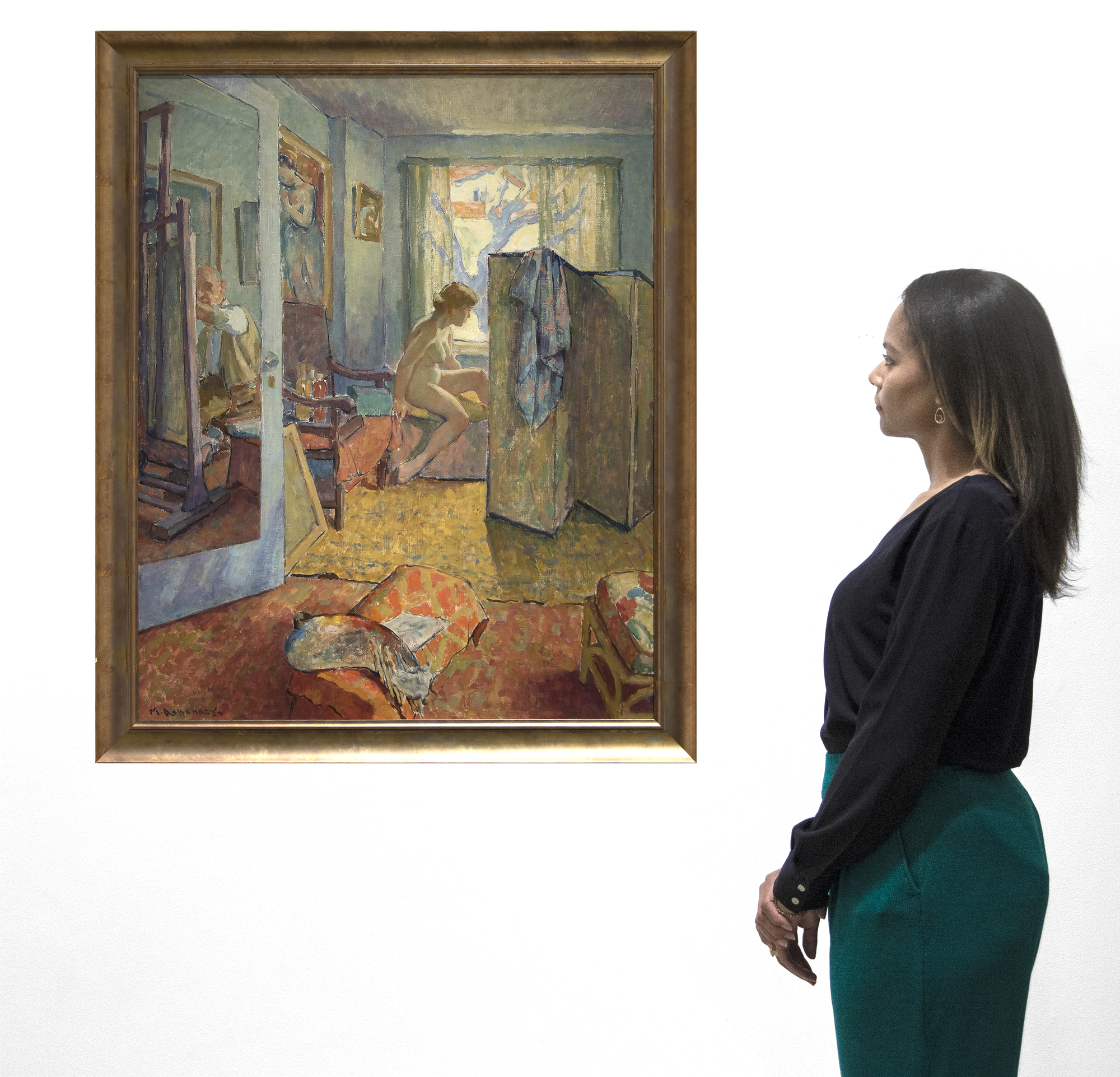 "Interior" is one of Maurice Askenazy’s more modern compositions, calling to mind the work of Bonnard or Vuillard. The intimate scene shows a nude female model, dramatically seen in profile, posing for a painter in a sun-drenched studio. The door to the room is open, giving the impression that the viewer is stealing a glimpse of a private interaction between artist and model. A cleverly placed mirror on the back of the open door reveals the reflection of the painter, who we are meant to take as Askenazy himself, at work. Askenazy takes great care to depict the details of the room, from the patterned ottoman to the framed paintings on the walls, each a mosaic of Impressionistic color.