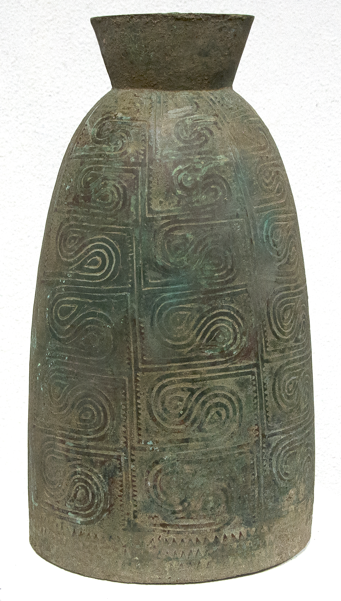 SOUTHEAST ASIAN - Thai Bell This well preserved bell is one of the largest known bronzes from the Southeast Asian Bronze Age, generally named after the Dongson site in North Vietnam. The swirling band design is finely and crisply cast. Dongson bronze drums were also reported in South China, Thailand, Laos, West Malaysia, and Indonesia and as Far East as Western Iranian Java. <br><br>The Dong Son culture is a Bronze age culture including all of southeast Asia and into the Indo-Malaya Archipelago from about 1000 to 1 BC. Centered on the Red River Valley of Vietnam, the Dong Son were sophisticated agriculturalists, raising rice and buffalo. Dong Son probably arose from local Neolithic cultures, such as Phung Nguyen and Dong Dau phases. Dong Son is identified with the Van Lang ruling dynasty, the first ruling dynasty of Vietnam. By the second century BC, impacts from the Han Dynasty in China were being felt and according to historic records, the Dong Son were absorbed into the Han Dynasty territory.