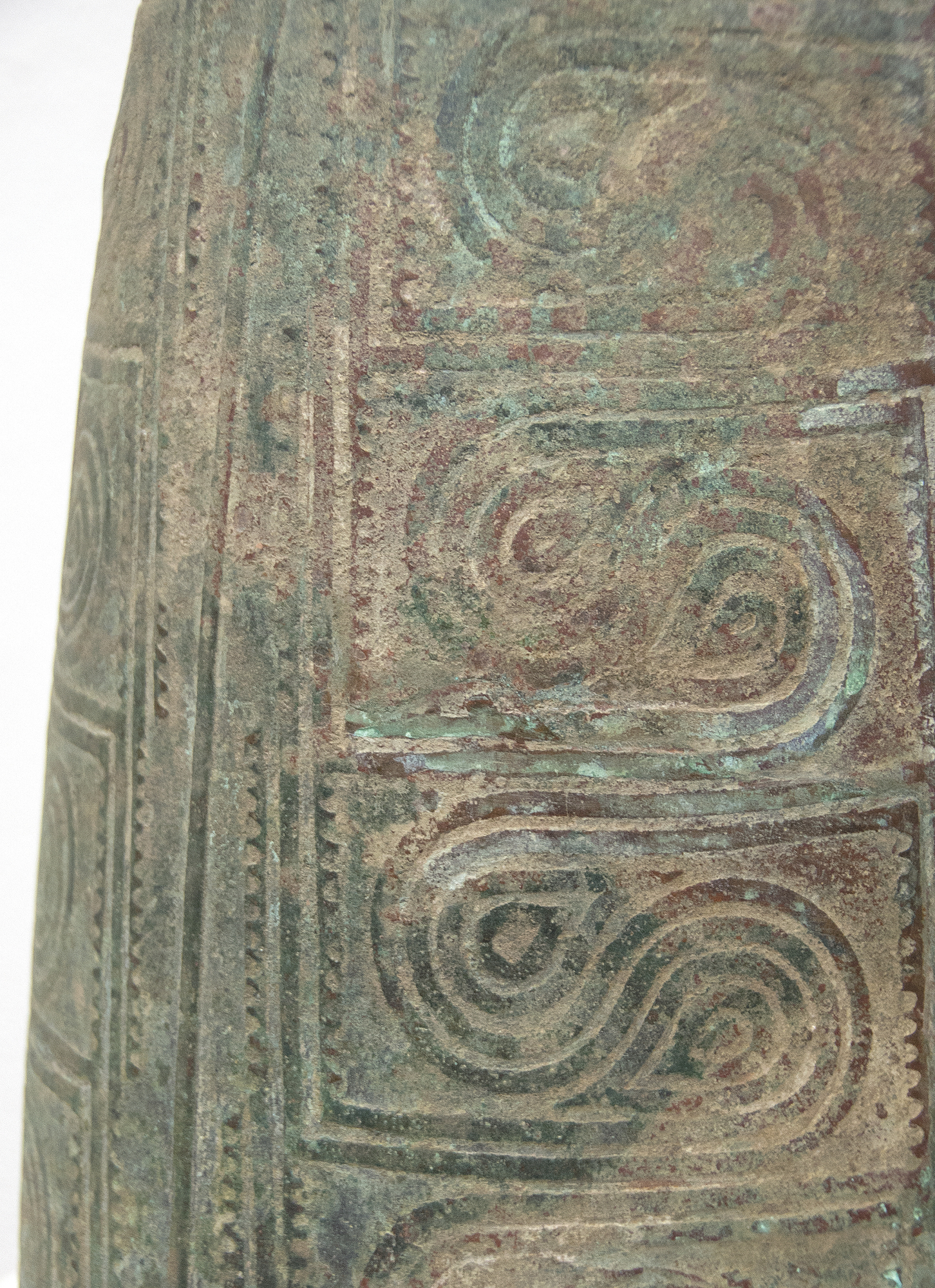 SOUTHEAST ASIAN - Thai Bell This well preserved bell is one of the largest known bronzes from the Southeast Asian Bronze Age, generally named after the Dongson site in North Vietnam. The swirling band design is finely and crisply cast. Dongson bronze drums were also reported in South China, Thailand, Laos, West Malaysia, and Indonesia and as Far East as Western Iranian Java. <br><br>The Dong Son culture is a Bronze age culture including all of southeast Asia and into the Indo-Malaya Archipelago from about 1000 to 1 BC. Centered on the Red River Valley of Vietnam, the Dong Son were sophisticated agriculturalists, raising rice and buffalo. Dong Son probably arose from local Neolithic cultures, such as Phung Nguyen and Dong Dau phases. Dong Son is identified with the Van Lang ruling dynasty, the first ruling dynasty of Vietnam. By the second century BC, impacts from the Han Dynasty in China were being felt and according to historic records, the Dong Son were absorbed into the Han Dynasty territory.