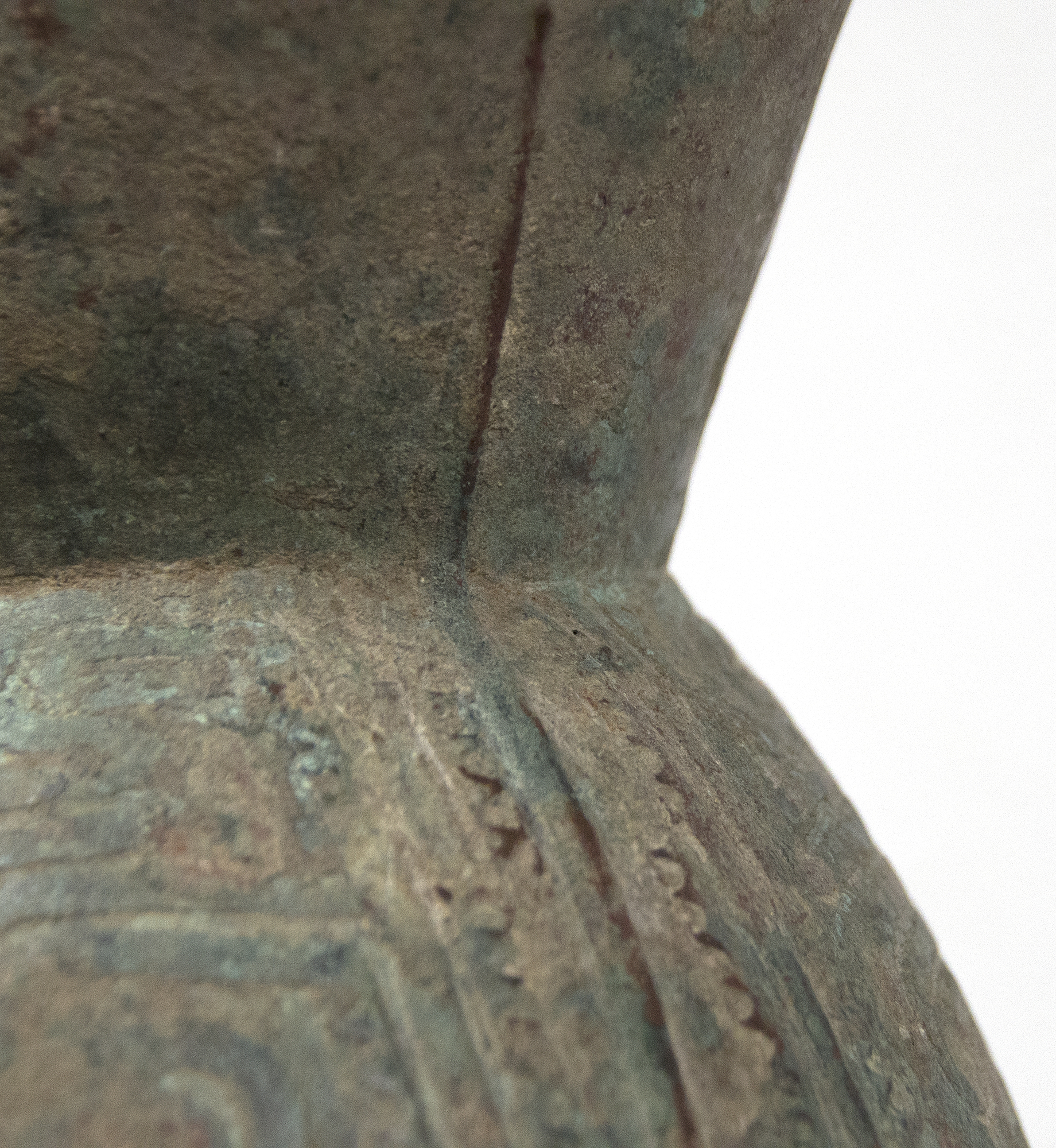 SOUTHEAST ASIAN - Thai Bell This well preserved bell is one of the largest known bronzes from the Southeast Asian Bronze Age, generally named after the Dongson site in North Vietnam. The swirling band design is finely and crisply cast. Dongson bronze drums were also reported in South China, Thailand, Laos, West Malaysia, and Indonesia and as Far East as Western Iranian Java. <br><br>The Dong Son culture is a Bronze age culture including all of southeast Asia and into the Indo-Malaya Archipelago from about 1000 to 1 BC. Centered on the Red River Valley of Vietnam, the Dong Son were sophisticated agriculturalists, raising rice and buffalo. Dong Son probably arose from local Neolithic cultures, such as Phung Nguyen and Dong Dau phases. Dong Son is identified with the Van Lang ruling dynasty, the first ruling dynasty of Vietnam. By the second century BC, impacts from the Han Dynasty in China were being felt and according to historic records, the Dong Son were absorbed into the Han Dynasty territory.