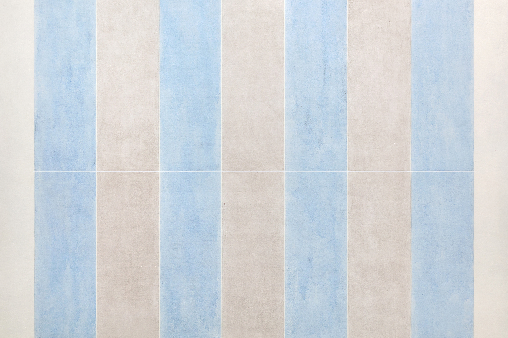 AGNES MARTIN - Untitled No. 7 Of the many modernist painters who imbued their geometries with a spiritual dimension, Agnes Martin is the one whose paintings resonate most deeply with a life of ascetic simplicity. In 1967, she left New York City and the art world, renounced worldly pursuits, and embarked on an eighteen-month odyssey across the untamed Western American landscape. It was the prelude to a life of seclusion, where on a remote mesa near Cuba, New Mexico, Martin built a sanctuary by hand, shaping adobe and timber into a unique domicile. Living without the conveniences of a telephone, electricity, or indoor plumbing, she practiced the art of life, not the life of a painter. That deeply devoted spiritual and moral quest separates Agnes Martin from the geometric visionaries such as Piet Mondrian or Ad Reinhardt, with whom she would otherwise be associated. After a seven-year hiatus, 62-year-old Martin reemerged in 1974 to renew her journey creating radiant minimalist paintings.
<br>
<br>"No. 7" (1974) is among the earliest paintings from this second major phase of her career. Intent upon emphasizing a dramatic reorientation emphasizing color rather than the line or tabulated grids of her pre-1967 work, a distanced viewing of the pale, luminescent bands allows for an expansive appreciation of subtle, radiant shifts between the color zones. Numerous natural phenomena and elements embedded in the New Mexican desert experience may have inspired these new and expansive ideas. The sheer verticality of its mesas, cliffs, and ravines, or the shafts of light that dramatically stream through gaps in clouds to the desert floor, may have inspired the vertical orientation here. Yet the impact of "No. 7" (1974) is most assuredly delivered via her devotion to Buddhist and Daoist ideals that seek beauty from within, not from extraneous points of reference. Martin asks the viewer to think of her repetitive shafts or bands of pale color as a sort of mantra as much as a visual experience. She challenges the capacity of our imagination, encouraging it to run free and consider this work as an object of contemplation, knowing well that her paintings require a degree of commitment. And as if to admonish those without the patience to absorb the impact of the otherworldly mystical radiance inherent in the paintings or how they affect one's greater awareness of the potential for expressing the sublime, we have her comment, "There's nobody who can't stand all afternoon in front of a waterfall."