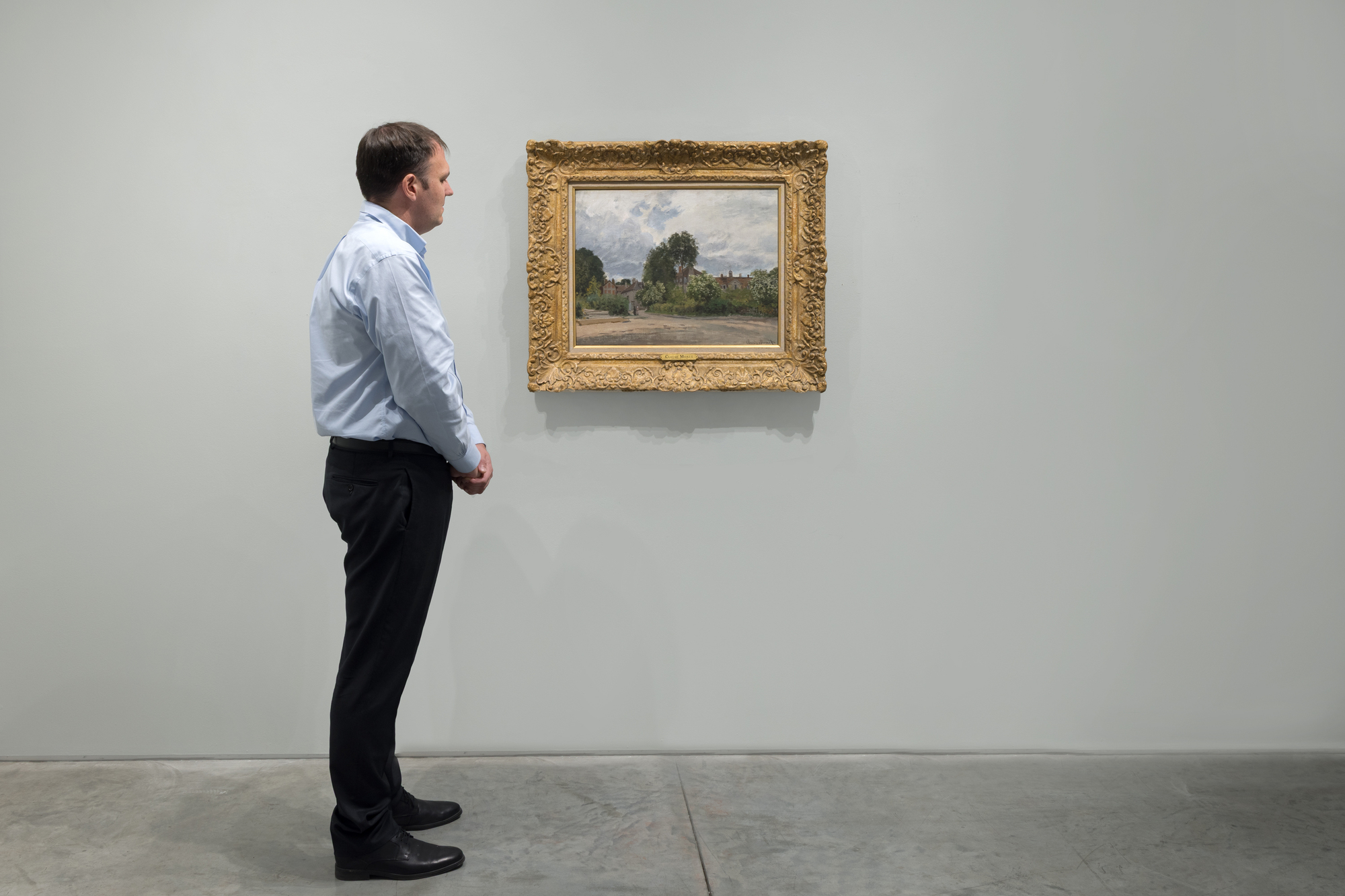 <div><font face=Lato size=3 color="#191919"><em>Argenteuil, l’Hospice</em> from 1872 belongs to one of the most formative chapters in Claude Monet’s career, painted during his early years in Argenteuil where he created nearly one hundred eighty canvases between 1871 and 1878. First owned by Paul Durand Ruel, Monet’s dealer and the most important champion of the Impressionists, the painting is included in the Wildenstein catalogue and was featured in the National Gallery London’s landmark exhibition <em>Monet and Architecture </em>in 2018. Created in the same year as his breakthrough <em>Impression, Sunrise</em>, the work reflects the moment when Monet’s vision for modern landscape took shape and laid the foundation for the movement that would soon be known as Impressionism.</font></div><br><br><div>&nbsp;</div><br><br><div><font face=Lato size=3 color="#191919">Monet settled in Argenteuil in late 1871, determined to renew his artistic direction after the upheavals of war and exile. The town offered an enticing blend of historical architecture, modern industry, rustic gardens, and the ever-shifting Seine, all within easy reach of Paris. The Aubrey House, where Monet lived, became a gathering place for Renoir, Manet, Sisley, Caillebotte, and later Pissarro, a setting that fostered both artistic exchange and the planning of the first Impressionist exhibition of 1874. As scholar Paul Hayes Tucker has noted, Argenteuil offered Monet a rare diversity of motifs that he encountered daily, ranging from the charmingly old to the strikingly new.</font></div><br><br><div>&nbsp;</div><br><br><div><font face=Lato size=3 color="#191919">In this painting Monet set his easel on rue Pierre Guienne, with his back to the Aubrey House, and painted the seventeenth century building that served at the time as the hospice of the Porte Saint Denis. The structure appears at right, viewed from the Seine, rendered with a quiet clarity that captures the atmosphere of an early spring day. The palette reflects both a reverence for the site’s history and an appreciation for Eugène Boudin, the friend and mentor who had encouraged Monet to paint the play of air and light years earlier and who joined him for a housewarming at Argenteuil on January 2, 1872. The hospice later became the Musée du Vieil Argenteuil, further reinforcing the historical resonance of the site.</font></div><br><br><div>&nbsp;</div><br><br><div><font face=Lato size=3 color="#191919"><em>Argenteuil, l’Hospice</em> stands as one of Monet’s earliest paintings from this crucial period and offers a faithful, atmospheric interpretation of a place deeply intertwined with the origins of Impressionism. Its blend of gentle tonalities, soft spring light, and direct observation reveals the artist’s growing confidence in painting the world as he perceived it, moment by moment, as a new vision for modern landscape art emerged.</font></div>