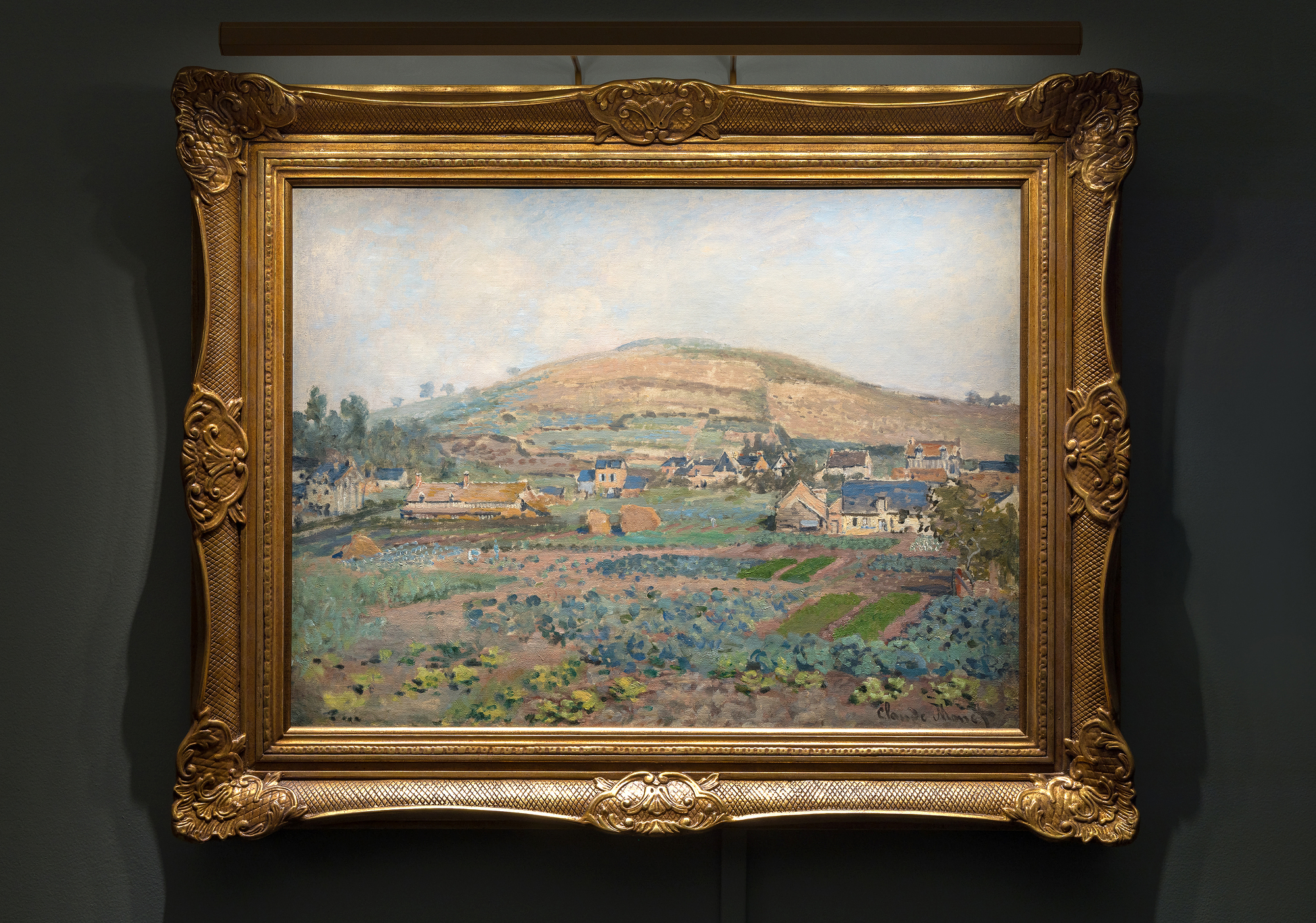 CLAUDE MONET - Le Mont Riboudet a Rouen au Printemps <div>Created at a seminal point early in the artist’s career, Le Mont Riboudet à Rouen au Printemps by Claude Monet, depicts a beautiful landscape with flora, figures working in the fields, and haystacks. The aesthetic is comparable to that of Camille Pisarro and Alfred Sisley, Monet’s contemporaries also working en plein air at the time to capture nuances of the French countryside on canvas. The painting’s distinguished provenance includes Durand-Ruel and Gustave Caillebotte.</div>