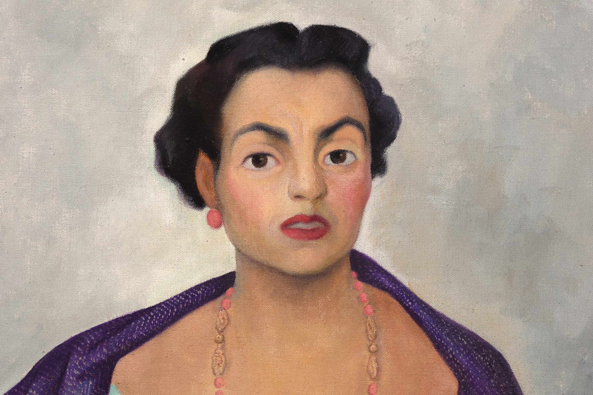 &lt;br&gt;In Diego Rivera’s portrait of Enriqueta Dávila, the artist asserts a Mexicanidad, a quality of Mexican-ness, in the work along with his strong feelings towards the sitter. Moreover, this painting is unique amongst his portraiture in its use of symbolism, giving us a strong if opaque picture of the relationship between artist and sitter.&lt;br&gt;&lt;br&gt;Enriqueta, a descendent of the prominent Goldbaum family, was married to the theater entrepreneur, José María Dávila. The two were close friends with Rivera, and the artist initially requested to paint Enriqueta’s portrait. Enriqueta found the request unconventional and relented on the condition that Rivera paints her daughter, Enriqueta “Quetita”. Rivera captures the spirit of the mother through the use of duality in different sections of the painting, from the floorboards to her hands, and even the flowers. Why the split in the horizon of the floorboard? Why the prominent cross while Enriqueta’s family is Jewish? Even her pose is interesting, showcasing a woman in control of her own power, highlighted by her hand on her hip which Rivera referred to as a claw, further complicating our understanding of her stature.&lt;br&gt;&lt;br&gt;This use of flowers, along with her “rebozo” or shawl, asserts a Mexican identity. Rivera was adept at including and centering flowers in his works which became a kind of signature device. The flowers show bromeliads and roselles; the former is epiphytic and the latter known as flor de jamaica and often used in hibiscus tea and aguas frescas. There is a tension then between these two flowers, emphasizing the complicated relationship between Enriqueta and Rivera. On the one hand, Rivera demonstrates both his and the sitter’s Mexican identity despite the foreign root of Enriqueta’s family but there may be more pointed meaning revealing Rivera’s feelings to the subject. The flowers, as they often do in still life paintings, may also refer to the fleeting nature of life and beauty. The portrait for her daughter shares some similarities from the use of shawl and flowers, but through simple changes in gestures and type and placement of flowers, Rivera illuminates a stronger personality in Enriqueta and a more dynamic relationship as filtered through his lens.&lt;br&gt;&lt;br&gt;A closer examination of even her clothing reveals profound meaning. Instead of a dress more in line for a socialite, Rivera has Enriqueta in a regional dress from Jalisco, emphasizing both of their Mexican identities. On the other hand, her coral jewelry, repeated in the color of her shoes, hints at multiple meanings from foreignness and exoticism to protection and vitality. From Ancient Egypt to Classical Rome to today, coral has been used for jewelry and to have been believed to have properties both real and symbolic. Coral jewelry is seen in Renaissance paintings indicating the vitality and purity of woman or as a protective amulet for infants. It is also used as a reminder, when paired with the infant Jesus, of his future sacrifice. Diego’s use of coral recalls these Renaissance portraits, supported by the plain background of the painting and the ribbon indicating the maker and date similar to Old Master works.&lt;br&gt;&lt;br&gt;When combined in the portrait of Enriqueta, we get a layered and tense building of symbolism. Rivera both emphasizes her Mexican identity but also her foreign roots. He symbolizes her beauty and vitality but look closely at half of her face and it is as if Rivera has painted his own features onto hers. The richness of symbolism hints at the complex relationship between artist and sitter.