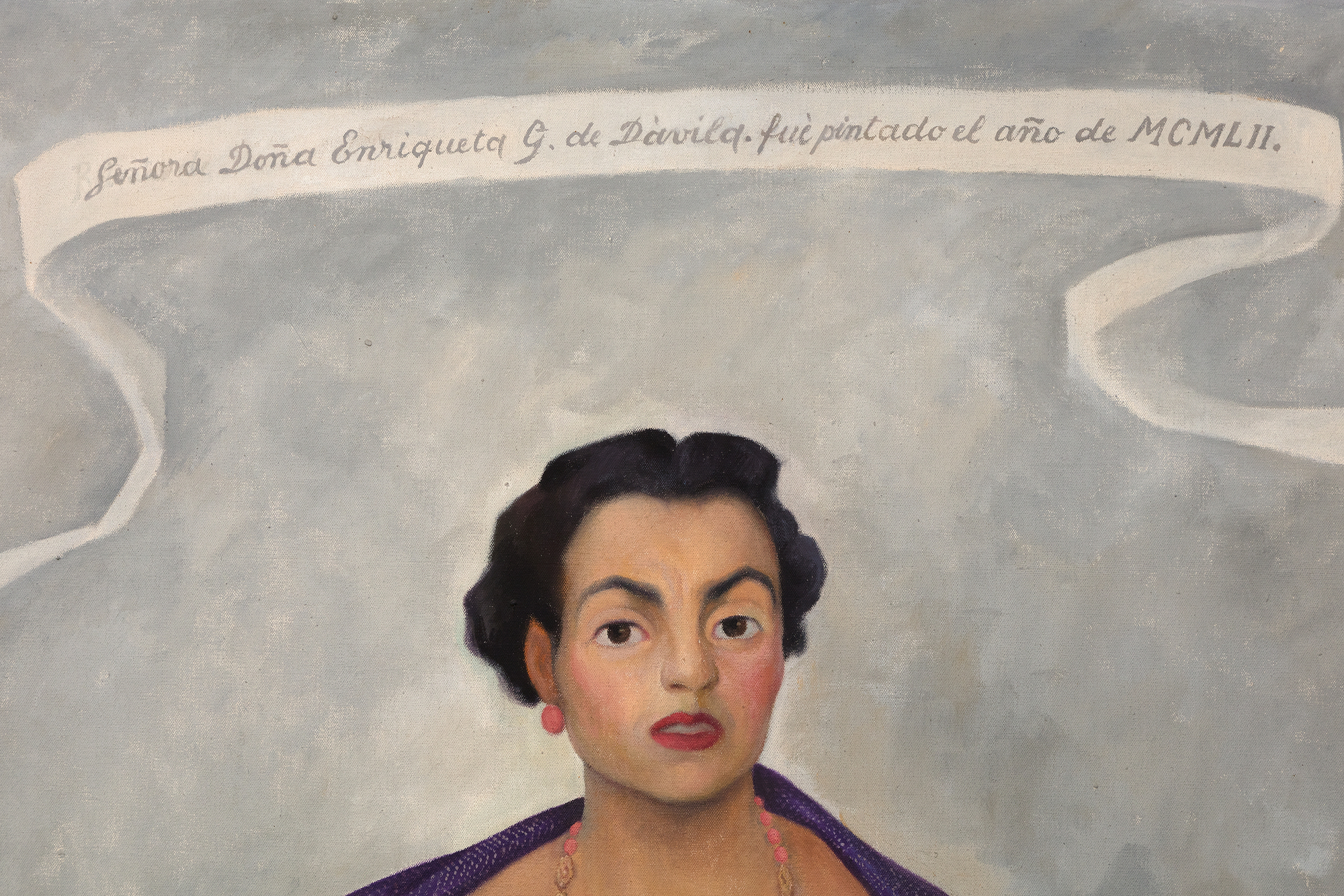 
<br>In Diego Rivera’s portrait of Enriqueta Dávila, the artist asserts a Mexicanidad, a quality of Mexican-ness, in the work along with his strong feelings towards the sitter. Moreover, this painting is unique amongst his portraiture in its use of symbolism, giving us a strong if opaque picture of the relationship between artist and sitter.
<br>
<br>Enriqueta, a descendent of the prominent Goldbaum family, was married to the theater entrepreneur, José María Dávila. The two were close friends with Rivera, and the artist initially requested to paint Enriqueta’s portrait. Enriqueta found the request unconventional and relented on the condition that Rivera paints her daughter, Enriqueta “Quetita”. Rivera captures the spirit of the mother through the use of duality in different sections of the painting, from the floorboards to her hands, and even the flowers. Why the split in the horizon of the floorboard? Why the prominent cross while Enriqueta’s family is Jewish? Even her pose is interesting, showcasing a woman in control of her own power, highlighted by her hand on her hip which Rivera referred to as a claw, further complicating our understanding of her stature.
<br>
<br>This use of flowers, along with her “rebozo” or shawl, asserts a Mexican identity. Rivera was adept at including and centering flowers in his works which became a kind of signature device. The flowers show bromeliads and roselles; the former is epiphytic and the latter known as flor de jamaica and often used in hibiscus tea and aguas frescas. There is a tension then between these two flowers, emphasizing the complicated relationship between Enriqueta and Rivera. On the one hand, Rivera demonstrates both his and the sitter’s Mexican identity despite the foreign root of Enriqueta’s family but there may be more pointed meaning revealing Rivera’s feelings to the subject. The flowers, as they often do in still life paintings, may also refer to the fleeting nature of life and beauty. The portrait for her daughter shares some similarities from the use of shawl and flowers, but through simple changes in gestures and type and placement of flowers, Rivera illuminates a stronger personality in Enriqueta and a more dynamic relationship as filtered through his lens.
<br>
<br>A closer examination of even her clothing reveals profound meaning. Instead of a dress more in line for a socialite, Rivera has Enriqueta in a regional dress from Jalisco, emphasizing both of their Mexican identities. On the other hand, her coral jewelry, repeated in the color of her shoes, hints at multiple meanings from foreignness and exoticism to protection and vitality. From Ancient Egypt to Classical Rome to today, coral has been used for jewelry and to have been believed to have properties both real and symbolic. Coral jewelry is seen in Renaissance paintings indicating the vitality and purity of woman or as a protective amulet for infants. It is also used as a reminder, when paired with the infant Jesus, of his future sacrifice. Diego’s use of coral recalls these Renaissance portraits, supported by the plain background of the painting and the ribbon indicating the maker and date similar to Old Master works.
<br>
<br>When combined in the portrait of Enriqueta, we get a layered and tense building of symbolism. Rivera both emphasizes her Mexican identity but also her foreign roots. He symbolizes her beauty and vitality but look closely at half of her face and it is as if Rivera has painted his own features onto hers. The richness of symbolism hints at the complex relationship between artist and sitter.