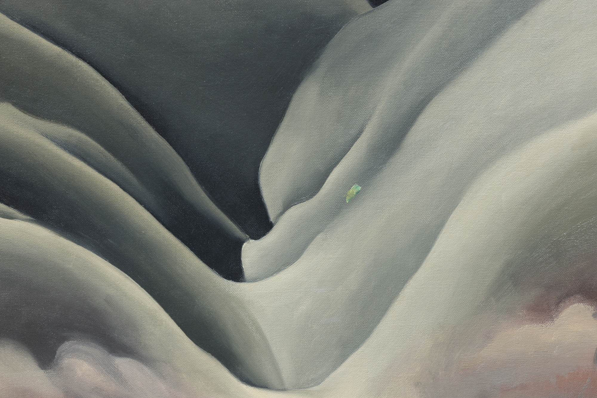 <div>Georgia O’Keeffe’s <em>Black Place II</em> (1945) belongs to one of the most profound and austere series of her career, inspired by repeated journeys to the Bisti Badlands, a remote, otherworldly area of northwestern New Mexico that she called the Black Place. Deeply compelled by this landscape, O’Keeffe often camped there so she could study its shifting forms and tonal subtleties at different hours of the day. In this work, she reduces the scene to its essentials: two massive hills pressing together, no visible horizon, and a composition defined by gravity, stillness, and quiet monumentality. The sweeping, interlocking forms create a sense of scale that feels both intimate and immense, evoking a landscape experienced as presence rather than panorama. </div><br><br><div>&nbsp;</div><br><br><div>Works from the Black Place series are exceptionally rare. Of the fourteen canvases O’Keeffe painted, only four remain in private hands; the remainder are held by major institutions including The Metropolitan Museum of Art, SFMOMA, and the Art Institute of Chicago. As a result, opportunities to encounter a work from this group outside of museum collections are exceedingly uncommon. </div><br><br><div>&nbsp;</div><br><br><div><em>Black Place II </em>has an illustrious lineage, from its earliest days in the holdings of Alfred Stieglitz’s famous New York gallery, An American Place, to the noted Philadelphia philanthropist and collector Daniel Dietrich, to the collection of Jan T. and Marica Vilcek. The painting’s legacy is further underscored by its unusually long institutional life. It was shown as early as 1946 at Stieglitz’s An American Place, and has continued to appear in major institutional retrospectives, including exhibitions at the Centre Pompidou and, most recently, the Museum of Fine Arts, Boston. This sustained public and scholarly attention has firmly established the importance of the Black Place paintings within O’Keeffe’s oeuvre. </div>