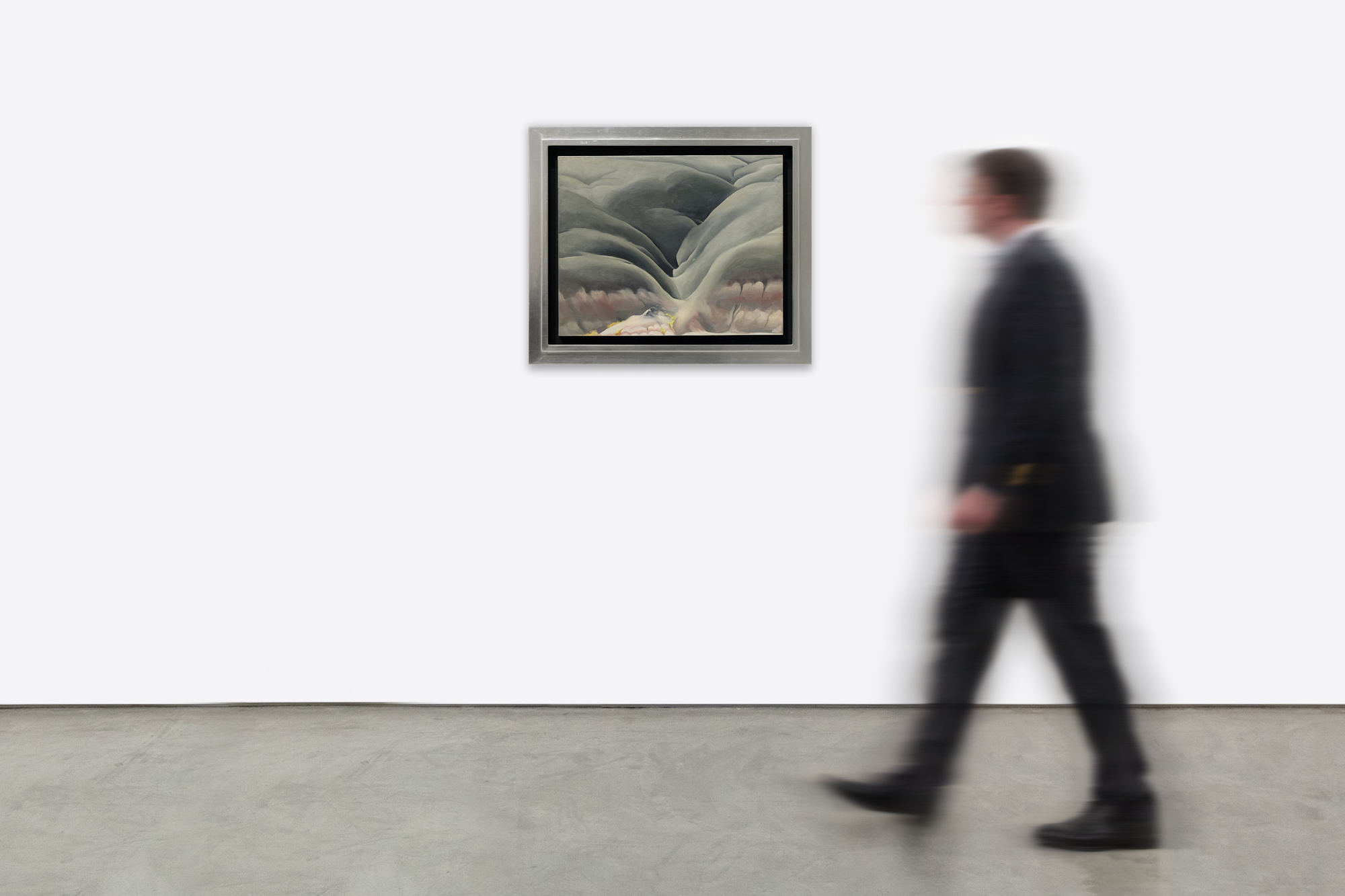 <div>Georgia O’Keeffe’s <em>Black Place II</em> (1945) belongs to one of the most profound and austere series of her career, inspired by repeated journeys to the Bisti Badlands, a remote, otherworldly area of northwestern New Mexico that she called the Black Place. Deeply compelled by this landscape, O’Keeffe often camped there so she could study its shifting forms and tonal subtleties at different hours of the day. In this work, she reduces the scene to its essentials: two massive hills pressing together, no visible horizon, and a composition defined by gravity, stillness, and quiet monumentality. The sweeping, interlocking forms create a sense of scale that feels both intimate and immense, evoking a landscape experienced as presence rather than panorama. </div><br><br><div>&nbsp;</div><br><br><div>Works from the Black Place series are exceptionally rare. Of the fourteen canvases O’Keeffe painted, only four remain in private hands; the remainder are held by major institutions including The Metropolitan Museum of Art, SFMOMA, and the Art Institute of Chicago. As a result, opportunities to encounter a work from this group outside of museum collections are exceedingly uncommon. </div><br><br><div>&nbsp;</div><br><br><div><em>Black Place II </em>has an illustrious lineage, from its earliest days in the holdings of Alfred Stieglitz’s famous New York gallery, An American Place, to the noted Philadelphia philanthropist and collector Daniel Dietrich, to the collection of Jan T. and Marica Vilcek. The painting’s legacy is further underscored by its unusually long institutional life. It was shown as early as 1946 at Stieglitz’s An American Place, and has continued to appear in major institutional retrospectives, including exhibitions at the Centre Pompidou and, most recently, the Museum of Fine Arts, Boston. This sustained public and scholarly attention has firmly established the importance of the Black Place paintings within O’Keeffe’s oeuvre. </div>