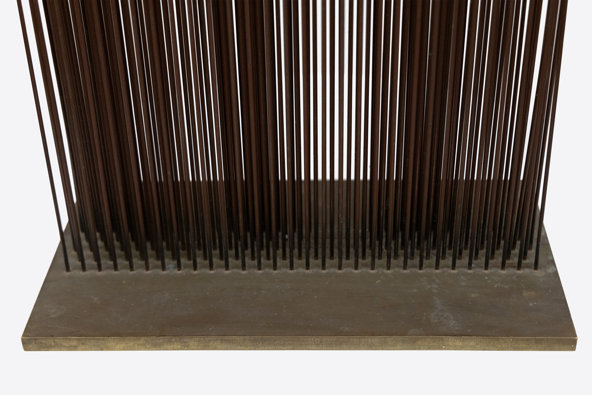 <div><font face=Calibri size=3 color=black>Harry Bertoia was an authentic visionary in art, and they are rare. Of those whose métier is sculpture, Alexander Calder and Harry Bertoia are the twentieth-century American standouts. They are engineers of beauty; their creative currency is feats of invention and pure artistry that honor our experience of them (if we are willing to quiet our mind) as if a sacred event. It was Duchamp who suggested Calder call his kinetic works “mobiles”, but it was up to Bertoia himself to coin a word to describe something for which there was little precedent. Visually precise, kinetic, and offering resonant, vibratory sound, a “Sonambient” sculpture is at once a metaphor for our sentient experience in the world yet capable of inducing an aura of transcendent experience. Given that insight, it is easy to understand Bertoia’s view that “I don’t hold onto terms like music and sculpture anymore. Those old distinctions have lost all their meaning.”</font></div>
<br>
<br><div> </div>
<br>
<br><div><font face=Calibri size=3 color=black>The present “Sonambient” sculpture is a forty-eight-inch-tall curtain of thin-gauged tines. Once activated, it becomes a 15 3/4 inch long, 8 inches deep wall of sound. Five rows of narrow tines are staggered in number, alternating between 30 and 29 tines that, when activated, present as an undulating wall of sound. When touched or moved by air currents, the rods produce a sound that, while metallic, does not betray its source of inspiration: the serene connection Bertoia felt in observing the gentle undulating movement of desert grasses. As always, this is a Bertoia sculpture that invites participation in the experience of changing shapes and sounds, a participatory work that asks us to be present in the moment, to connect across time with the object and its creator.</font></div>