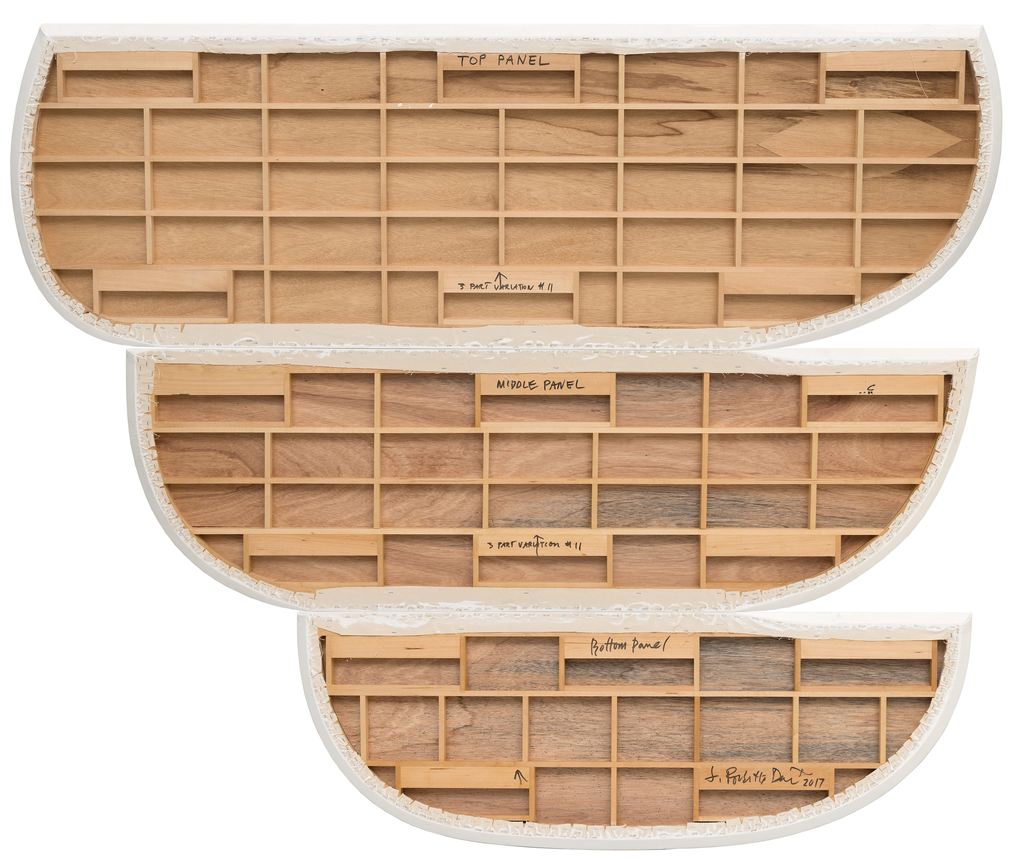 <div>Joanna Pousette-Dart’s 3 Part Variation No. 11 (2017) is composed of three stacked, curvilinear canvases—forms that resemble canoe hulls or slices of a circle—rising in scale from bottom to top. Each panel has its own restrained palette of blues, yellows, and grays, distinct yet resonant with the others. The proportions and curves echo from one to the next, yet no two forms are alike. </div>
<br>
<br><div> </div>
<br>
<br><div>Within each panel, broad areas of flat color are bisected by rounded shapes whose outer contours align with the painting’s edge. Layered over these are linear arabesque-like structures that visually rhyme—but never directly repeat—the panels’ curves, creating a dynamic interplay between inner drawing and outer shape. The result is both lyrical and precise, a composition where subtle variations generate a complex harmony. </div>
<br>
<br><div> </div>
<br>
<br><div>The beauty of 3 Part Variation No. 11 lies in these relationships: how forms mirror, diverge, and converge across the three canvases. The effect is meditative, like a visual equation that is at once architectural and deeply personal. </div>