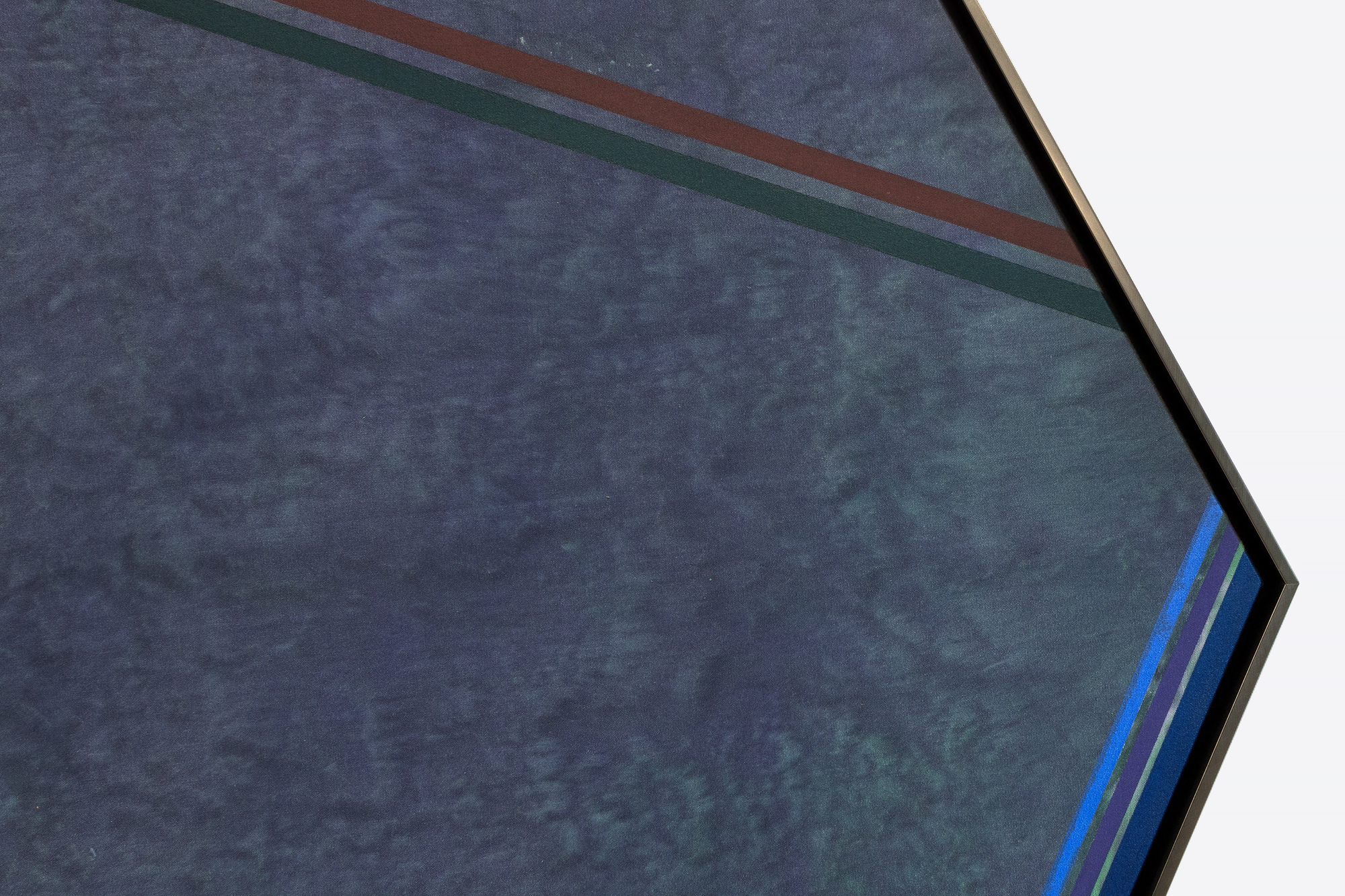 <div><font face=Lato size=3 color=black>Kenneth Noland’s <em>Gray Reflection</em> (1978) comes from the late 1970s, when the artist was deeply engaged with shaped canvases and the refinement of surface and form. The cool slate ground is animated by faint tonal shifts and angled color bands that cut across the polygonal field, creating both balance and quiet momentum.<br><br></font></div><br><br><div><font face=Lato size=3 color=black>This period was far less prolific than his celebrated 1960s circle paintings, making works such as <em>Gray Reflection </em>comparatively rare. While not part of a named series, it resonates with other late-1970s explorations like <em>Burnt Beige </em>at the Cranbrook Art Museum.<br><br></font></div><br><br><div><font face=Lato size=3 color=black>Noland, a central figure of post-painterly abstraction alongside Morris Louis and Helen Frankenthaler, is represented in major museum collections including MoMA, Tate, and the National Gallery of Art.</font></div>