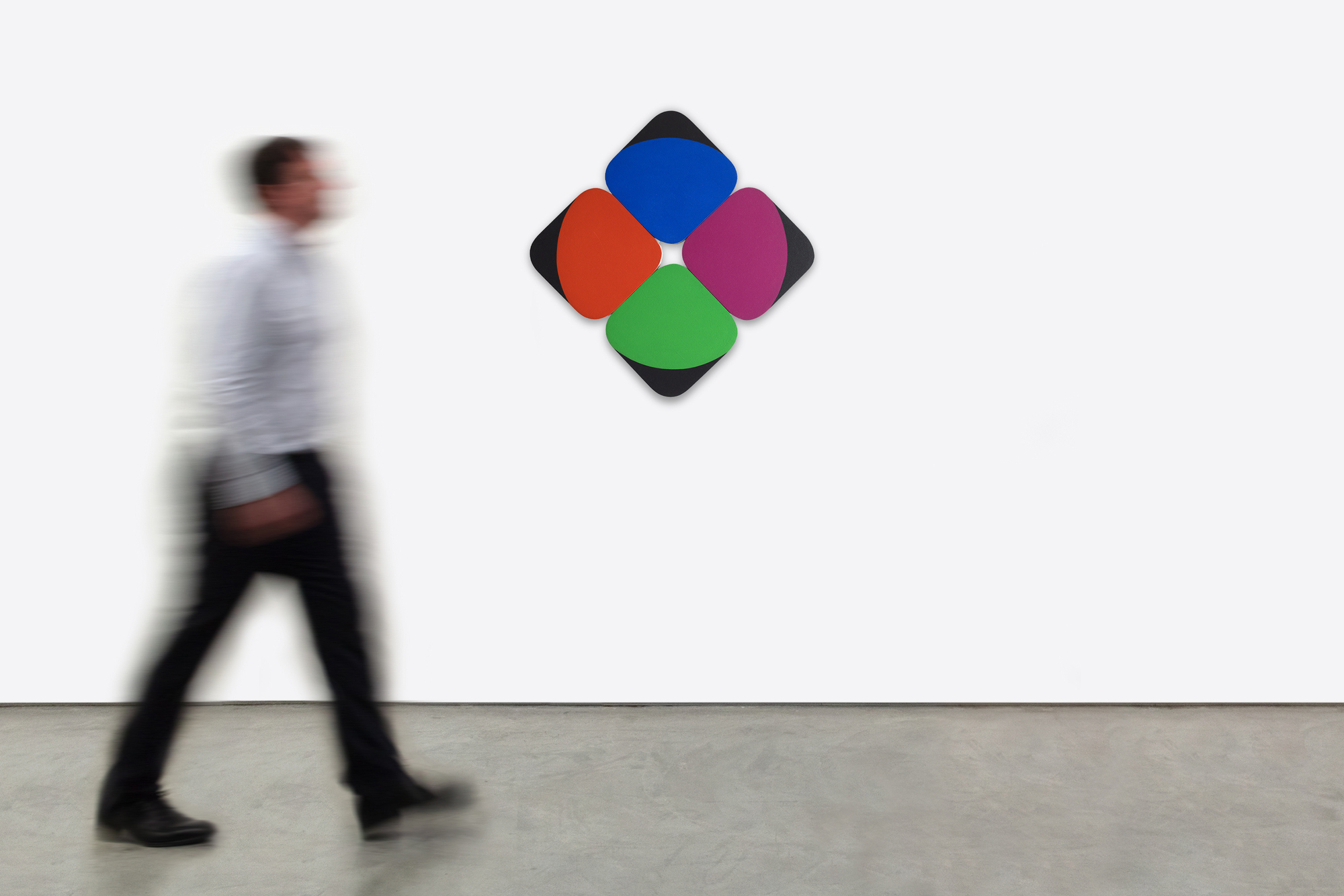 <div><font face=Lato size=3>Leon Polk Smith’s "Constellation Blue Violet Green Red" (1968) is a striking example of the artist’s radical exploration of form and color in postwar abstraction. Executed in acrylic on canvas, the work consists of four rounded-square panels arranged in a diamond formation. Each panel bears a crisp division of color: black at the outer edge, paired with one of four luminous hues—blue, violet, green, and red—creating a rhythmic interplay of symmetry and variation. </font></div>
<br>
<br><div><font face=Lato size=3> </font></div>
<br>
<br><div><font face=Lato size=3>Smith was a central figure in the development of hard-edge painting and geometric abstraction, aligned with contemporaries such as Ellsworth Kelly and Carmen Herrera. His "Constellation" series, begun in the 1960s, was groundbreaking for its use of multiple shaped canvases installed directly on the wall, eschewing traditional frames in favor of compositions that expand dynamically into surrounding space. </font></div>
<br>
<br><div><font face=Lato size=3> </font></div>
<br>
<br><div><font face=Lato size=3>While Smith was highly prolific in both works on paper and monumental single-panel paintings, multi-panel "Constellation" works remain less common within his oeuvre. Today, his paintings are represented in major institutions including The Museum of Modern Art, the Whitney Museum of American Art, and the Brooklyn Museum. In "Constellation Blue Violet Green Red", the clarity of Smith’s vision is on full display—color and geometry united in a constellation that feels both precise and expansive, disciplined yet alive with visual energy. </font></div>