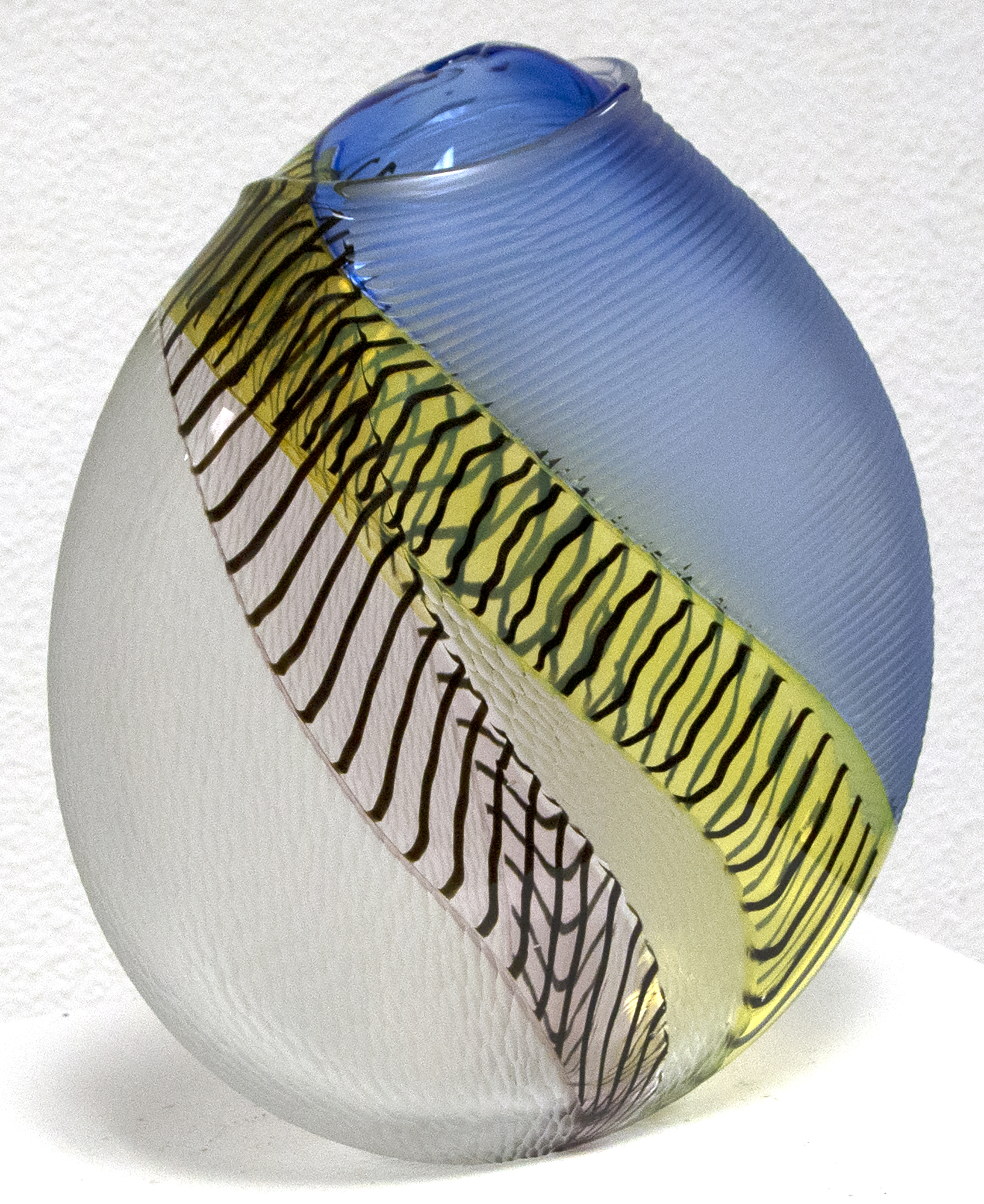 Hand blown glass with multiple incalmo of colored glass and filligrana. Switching the axel of the glass bubble and adjoining two glass bubbles with raticallo technique. Engraved partially on the surface with different patterns.&lt;br&gt;&lt;br&gt;Lino Tagliapietra, a native to Murano, is one of the world&#039;s preeminent glass artists.