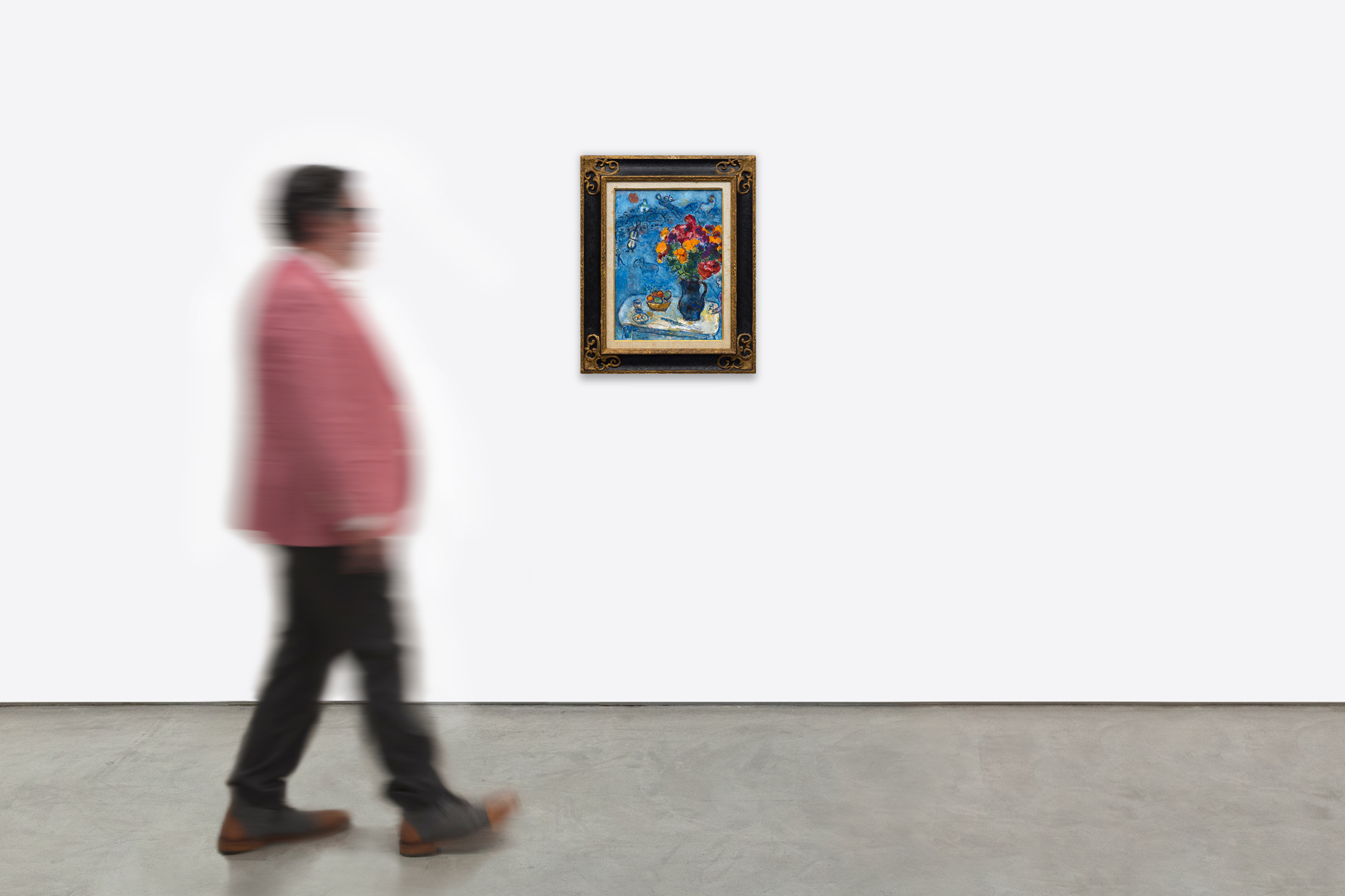 <div><font face=Lato size=3 color=black>Marc Chagall’s <em>Sur la table</em> is a radiant celebration of color, memory, and imagination. Bathed in a deep blue palette, the painting brings together several of the artist’s most beloved motifs: a rooster, violinist, goat, and exuberant bouquet. The composition is animated with Chagall’s signature sense of movement and dreamlike harmony, creating a world where everyday life, folklore, and love coexist in vibrant equilibrium.</font></div><br><br><div>&nbsp;</div><br><br><div><font face=Lato size=3 color=black>Painted in a richly productive period just after Chagall’s return to his homeland in the early 1970s, <em>Sur la table</em> reflects the renewed emotional and visual energy that came from reconnecting with his roots in Vitebsk, represented here by the white domed church in the distance. The expansive bouquet, one of Chagall’s enduring symbols of love for his first wife, Bella, dominates the foreground and infuses the work with emotional warmth and vitality.</font></div><br><br><div>&nbsp;</div><br><br><div><font face=Lato size=3 color=black>The painting remained in Chagall’s own collection and estate until after his death in 1985, underscoring its personal significance. Authenticated by the Comité Marc Chagall, <em>Sur la table</em> belongs to a lineage of floral and symbolic compositions that define his mature work.</font></div>