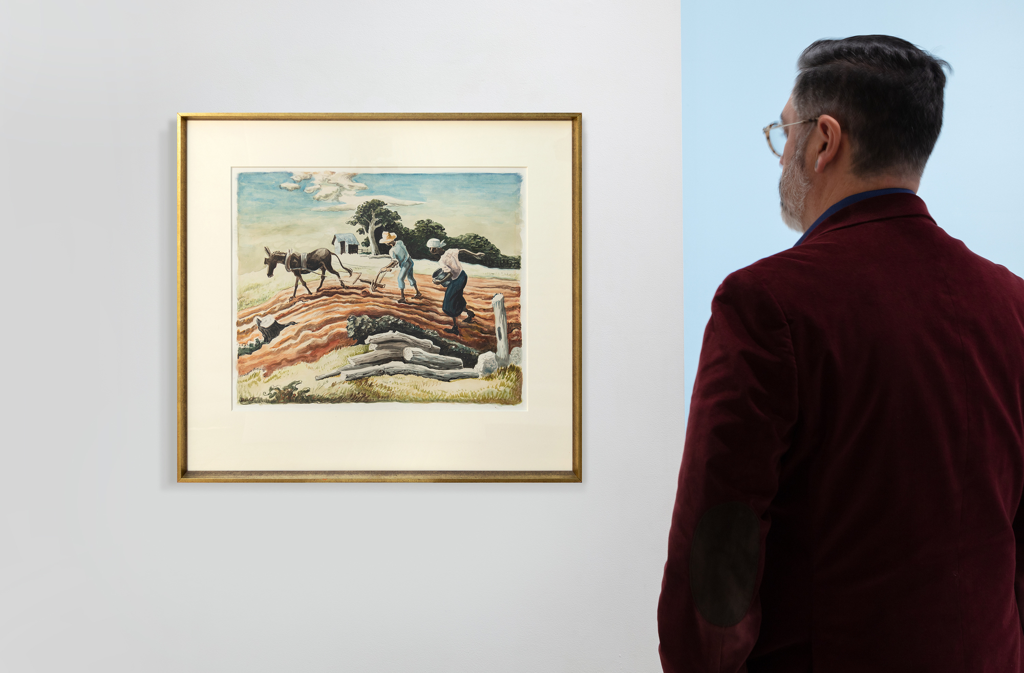 <div>"Planting (Spring Plowing)", a vibrant watercolor and graphite on paper by Thomas Hart Benton, circa 1939-40, embodies the artist’s signature Regionalist style. The work depicts a rural scene where two figures toil in a field, one guiding a plow pulled by a donkey, the other carrying a bucket, sowing seeds under a bright, cloud-streaked sky. The rolling, richly hued earth, painted in warm browns and oranges, contrasts with the lush green foliage and distant trees, while a small structure sits at the horizon, grounding the composition in everyday life. Benton’s dynamic lines and fluid brushwork capture the rhythm of labor and the vitality of spring, infusing the scene with a sense of movement and purpose. </div>
<br>
<br><div> </div>
<br>
<br><div>The reverse image of this artwork was transformed into a lithograph in 1939, with notable examples housed in prestigious museum collections including the Smithsonian American Art Museum, Nelson Atkins Museum of Art, Minneapolis Institute of Art, and the Chazen Museum of Art. This print adaptation underscores the piece’s cultural significance, reflecting Benton’s influence on American art during the Depression era and the resonance of this particular subject celebrating the resilience and harmony of its people with nature. Created with a keen eye for detail and a deep connection to the land, "Planting (Spring Plowing)" showcases Benton’s ability to blend realism with his hallmark muscular style. It is accompanied by two letters written by Thomas Hart Benton to Lon Ramsey, its original owner, and bears an inscription by the artist on the verso.  </div>