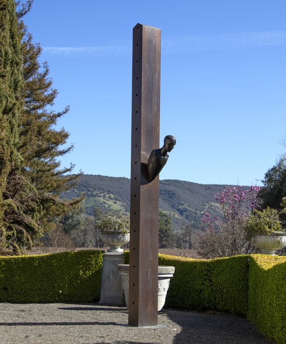 Mimmo Paladino began making sculptures in the early 1980s and became a central figure in the Transavanguardia movement. Artists such as Francesco Clemente, Sandro Chia, Enzo Cucchi and Nicola de Maria sought to bring emotion, figuration, and mysticism back into avant-garde art. <br><br>In this untitled large-scale piece from 1990, Paladino conveys the principle aims of Transavanguardia, which was a reaction against Minimalism by re-introducing the figure, creating a new narrative with a Humanist’s point of view. Here, the mounted figure emerges dramatically from the basic and essential form of a tall box column as if the intent were to realize in form these diametrically opposed aesthetics. The severe diagonal attitude of the figure relative to the column suggests its emergent corporeal nature – that it is born of elements of that essential nature and simple geometry inherent in that box column. It is a figure that is falling from the column as much as it is emerging from it. Perhaps it is 'born' of it.  <br><br>Paladino’s work has been exhibited at prestigious institutions worldwide, including the Museum of Modern Art in New York, the Royal Academy of Art in London, the Paris Biennale, the Sydney Biennial, “Documenta 7” in Kassel, the Hirshhorn Museum and Sculpture Garden, and many others.