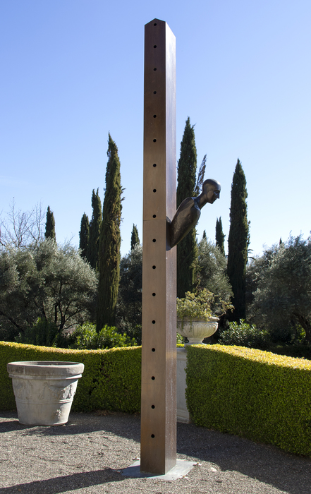 MIMMO PALADINO - Untitled Mimmo Paladino began making sculptures in the early 1980s and became a central figure in the Transavanguardia movement. Artists such as Francesco Clemente, Sandro Chia, Enzo Cucchi and Nicola de Maria sought to bring emotion, figuration, and mysticism back into avant-garde art.
<br>
<br>In this untitled large-scale piece from 1990, Paladino conveys the principle aims of Transavanguardia, which was a reaction against Minimalism by re-introducing the figure, creating a new narrative with a Humanist’s point of view. Here, the mounted figure emerges dramatically from the basic and essential form of a tall box column as if the intent were to realize in form these diametrically opposed aesthetics. The severe diagonal attitude of the figure relative to the column suggests its emergent corporeal nature – that it is born of elements of that essential nature and simple geometry inherent in that box column. It is a figure that is falling from the column as much as it is emerging from it. Perhaps it is 'born' of it.
<br>
<br>Paladino’s work has been exhibited at prestigious institutions worldwide, including the Museum of Modern Art in New York, the Royal Academy of Art in London, the Paris Biennale, the Sydney Biennial, “Documenta 7” in Kassel, the Hirshhorn Museum and Sculpture Garden, and many others.