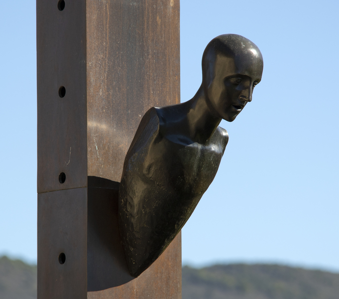 MIMMO PALADINO - Untitled Mimmo Paladino began making sculptures in the early 1980s and became a central figure in the Transavanguardia movement. Artists such as Francesco Clemente, Sandro Chia, Enzo Cucchi and Nicola de Maria sought to bring emotion, figuration, and mysticism back into avant-garde art.
<br>
<br>In this untitled large-scale piece from 1990, Paladino conveys the principle aims of Transavanguardia, which was a reaction against Minimalism by re-introducing the figure, creating a new narrative with a Humanist’s point of view. Here, the mounted figure emerges dramatically from the basic and essential form of a tall box column as if the intent were to realize in form these diametrically opposed aesthetics. The severe diagonal attitude of the figure relative to the column suggests its emergent corporeal nature – that it is born of elements of that essential nature and simple geometry inherent in that box column. It is a figure that is falling from the column as much as it is emerging from it. Perhaps it is 'born' of it.
<br>
<br>Paladino’s work has been exhibited at prestigious institutions worldwide, including the Museum of Modern Art in New York, the Royal Academy of Art in London, the Paris Biennale, the Sydney Biennial, “Documenta 7” in Kassel, the Hirshhorn Museum and Sculpture Garden, and many others.