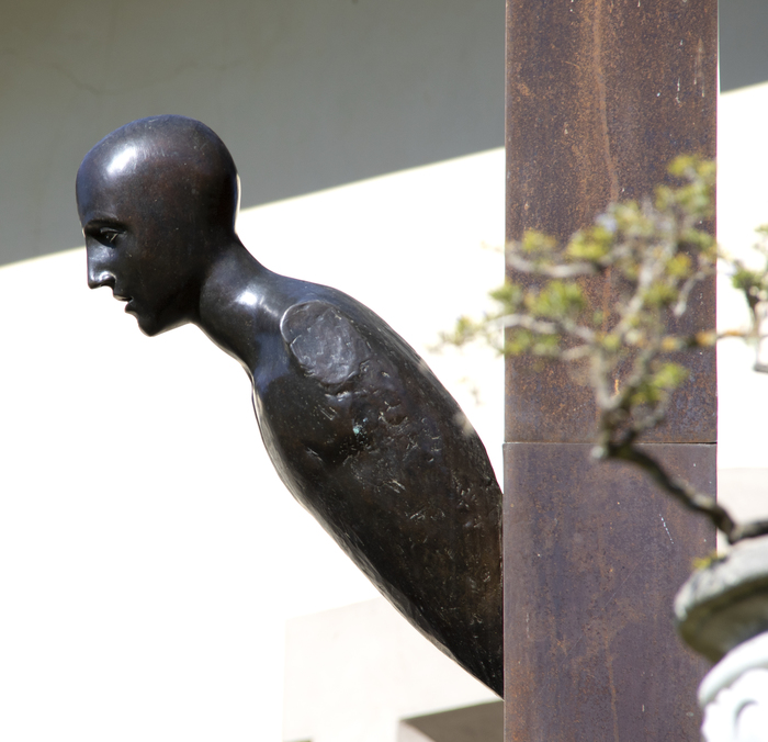MIMMO PALADINO - Untitled Mimmo Paladino began making sculptures in the early 1980s and became a central figure in the Transavanguardia movement. Artists such as Francesco Clemente, Sandro Chia, Enzo Cucchi and Nicola de Maria sought to bring emotion, figuration, and mysticism back into avant-garde art.
<br>
<br>In this untitled large-scale piece from 1990, Paladino conveys the principle aims of Transavanguardia, which was a reaction against Minimalism by re-introducing the figure, creating a new narrative with a Humanist’s point of view. Here, the mounted figure emerges dramatically from the basic and essential form of a tall box column as if the intent were to realize in form these diametrically opposed aesthetics. The severe diagonal attitude of the figure relative to the column suggests its emergent corporeal nature – that it is born of elements of that essential nature and simple geometry inherent in that box column. It is a figure that is falling from the column as much as it is emerging from it. Perhaps it is 'born' of it.
<br>
<br>Paladino’s work has been exhibited at prestigious institutions worldwide, including the Museum of Modern Art in New York, the Royal Academy of Art in London, the Paris Biennale, the Sydney Biennial, “Documenta 7” in Kassel, the Hirshhorn Museum and Sculpture Garden, and many others.