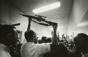 LAWRENCE SCHILLER - Oswald's Gun, Dallas Polic Station, Dallas Texas, November 23, 1963 - silver gelatin print - 16 x 20 in.