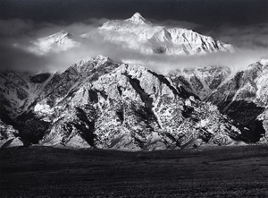 Ansel Adams' exploration of the Owens Valley and views of the towering eastern side of the Sierra Nevada Mountains hold immense significance. They are among the most iconic photographs that allowed Adams to capture the sweeping majesty of the Sierra Nevada while also giving a vivid impression of the depth and expanse of the arid valley floor. Mount Williamson, Sierra Nevada, from Owens Valley, was likely photographed in 1944, shortly after incorporating the Zone System that allowed for a wide tonal range and balanced exposure with clarity in both highlights and shadows. The present example, printed in August 1978, is in the collection of many museums, but among collectors, it is among the rarer prints by Ansel Adams.