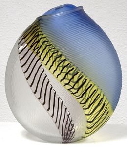 Hand blown glass with multiple incalmo of colored glass and filligrana. Switching the axel of the glass bubble and adjoining two glass bubbles with raticallo technique. Engraved partially on the surface with different patterns.
<br>
<br>Lino Tagliapietra, a native to Murano, is one of the world's preeminent glass artists.